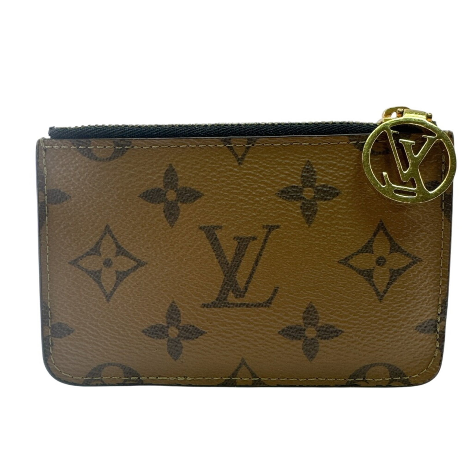 Louis Vuitton Monogram Reverse Coin Purse: Louis Vuitton Monogram Reverse Coin Purse The Louis Vuitton Monogram Reverse Coin Purse is a stylish and compact accessory featuring the iconic Monogram Reverse pattern. Made from high-quality materia