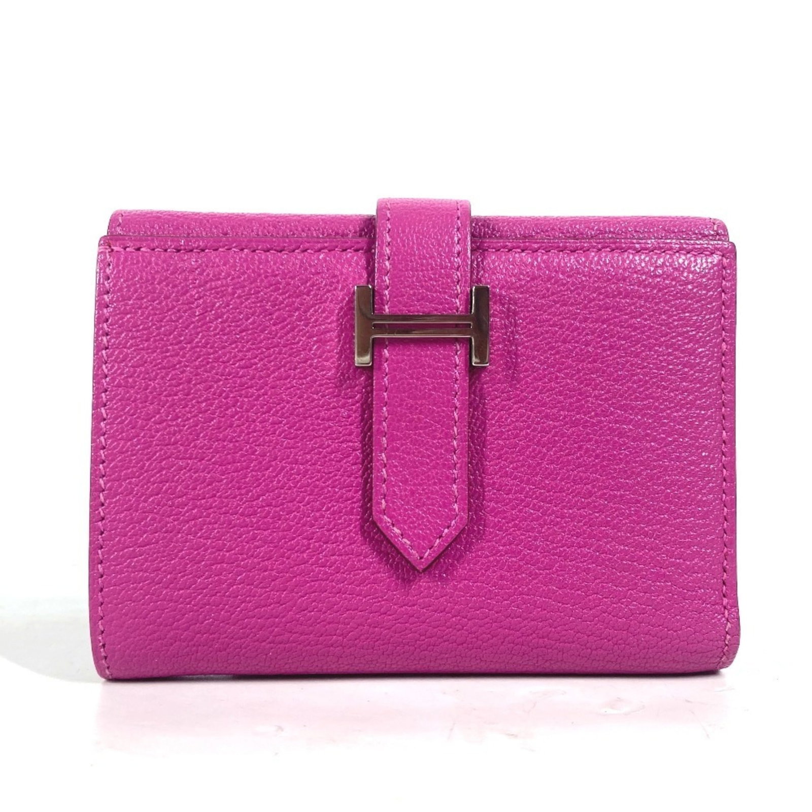 Chevre Leather Tri-Fold Wallet Hermes: Chevre Leather Tri-Fold Wallet Hermes Pink and Purple Chevre Leather Tri-Fold Wallet by Hermes. This tri-fold wallet features high-quality chevre leather in a beautiful pink and purple color