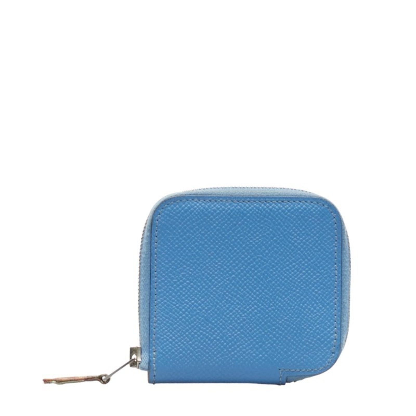 Hermes Coin Purse/ Coin Case Leather: Hermes Coin Purse/ Coin Case Leather The Hermes Silk'in Coin Purse is a sleek and stylish accessory, boasting a vibrant blue leather exterior and a compact 8cm x 8.5cm design that makes it easy to car