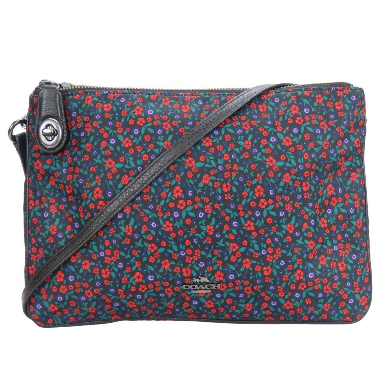 Nylon Leather Coach Bag: Nylon Leather Coach Bag Nylon and leather combine in this sleek Coach shoulder bag, measuring 18.5cm x 27cm x 4cm. The black and multi-color design adds visual interest, while the bag's compact size m