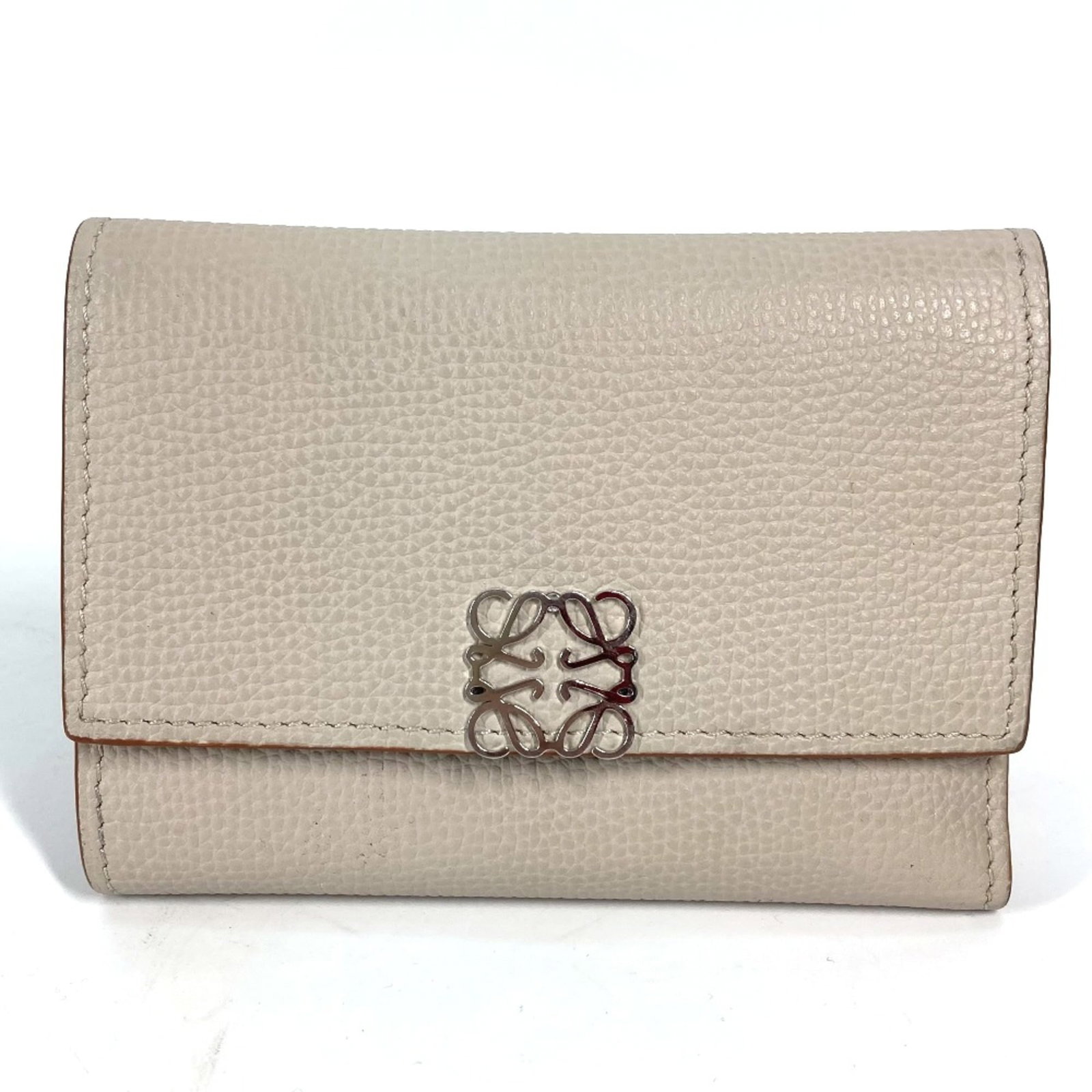 Loewe Wallet (Tri-Fold) Leather: Loewe Wallet (Tri-Fold) Leather Tri-fold leather wallet from Loewe, featuring a classic design with clean lines and a spacious interior. Made from high-quality beige leather, this wallet measures