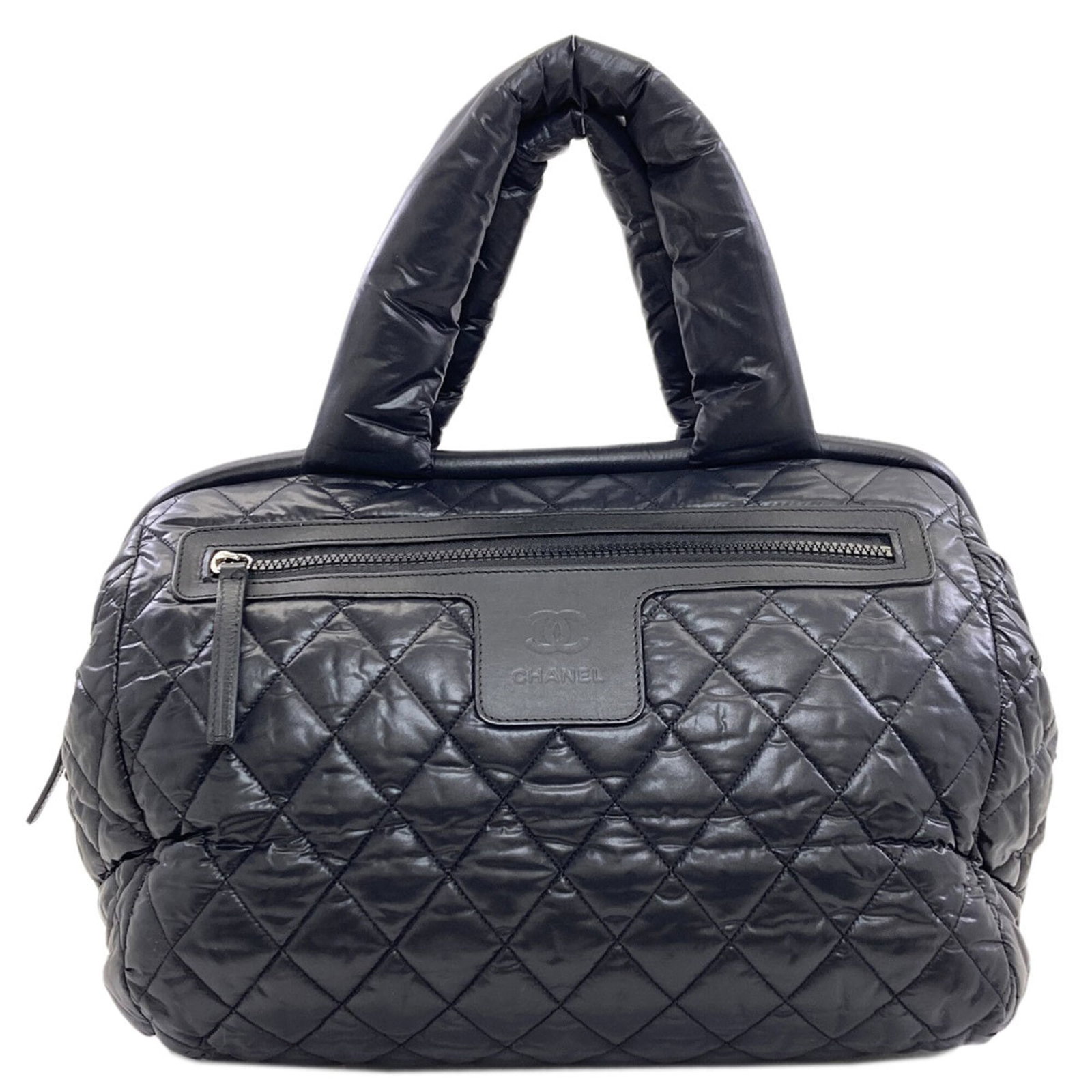 Boston Bag Nylon: Boston Bag Nylon Black Chanel Boston bag made from nylon, measuring 28cm x 34cm x 17cm. This classic design features a timeless silhouette and a durable nylon material. Item Specifics: Brand: Chanel