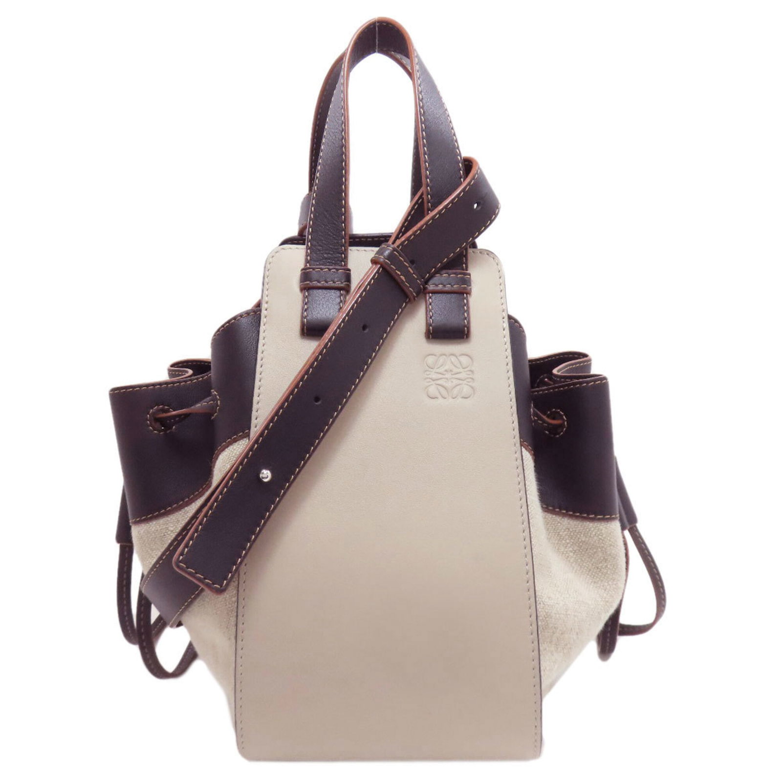 Canvas Leather Handbag Loewe: Canvas Leather Handbag Loewe Canvas Leather Handbag Loewe bears a signature. Made from canvas and calfskin leather, this beige and black handbag measures 25.5cm x 31cm x 24cm. Its unique combination