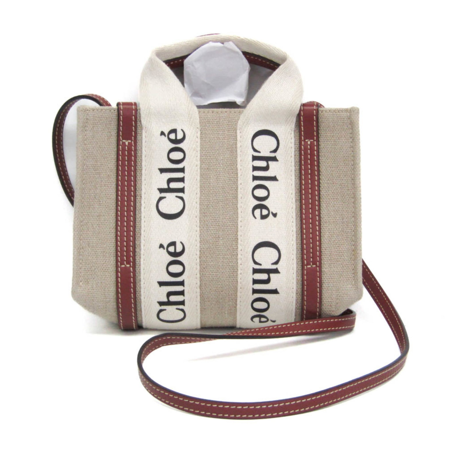 Shoulder Bag Canvas Leather: Shoulder Bag Canvas Leather Canvas and leather combine in this stylish shoulder bag from Chlo, featuring a light beige color and open pocket for added functionality. The bag's 110cm strap length and 2