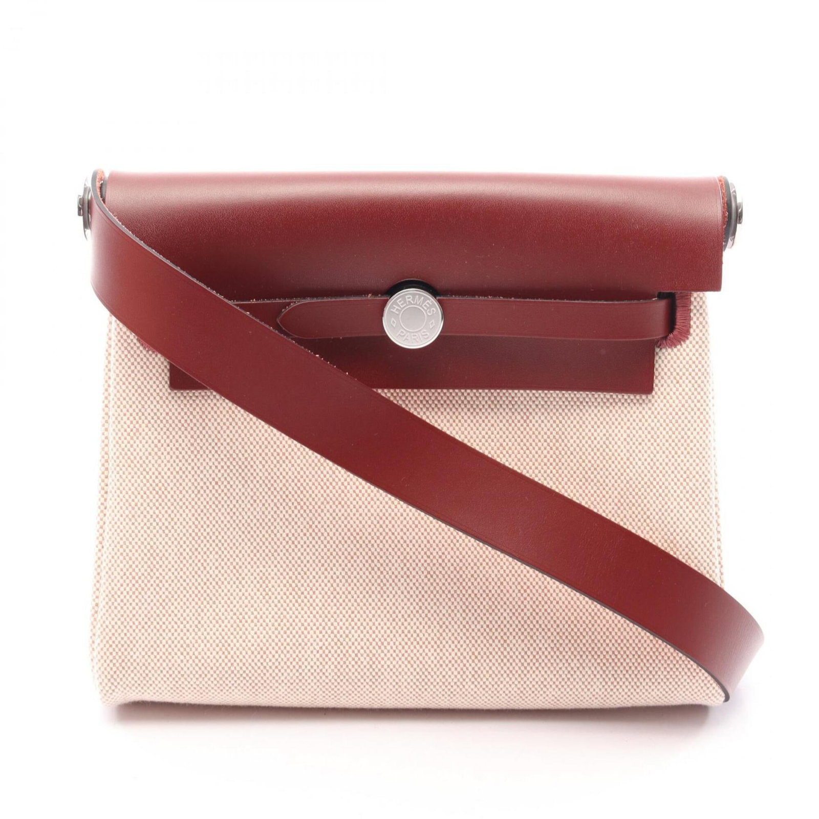 Shoulder Bag Canvas Leather Hermes: Shoulder Bag Canvas Leather Hermes Canvas and leather come together in a classic design, with a Bordeaux, Ecru, Ivory, or Rouge color option. This 16cm x 20cm x 7cm shoulder bag is a stylish and versa