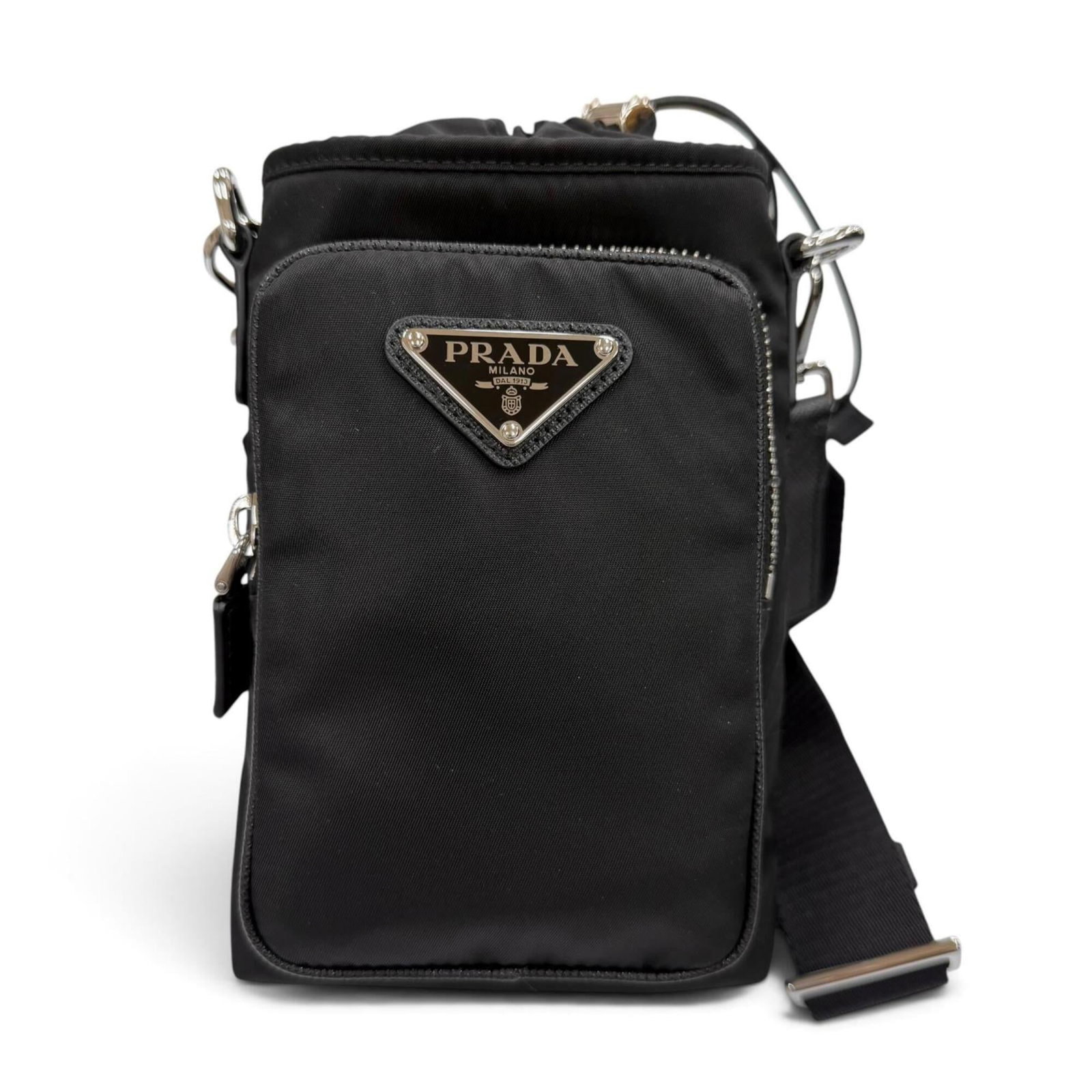 Shoulder Bag Nylon Leather Prada: Shoulder Bag Nylon Leather Prada Nylon and leather combine in this sleek black shoulder bag from Prada, measuring 21cm x 11cm x 3cm. The silver hardware adds a touch of sophistication to this