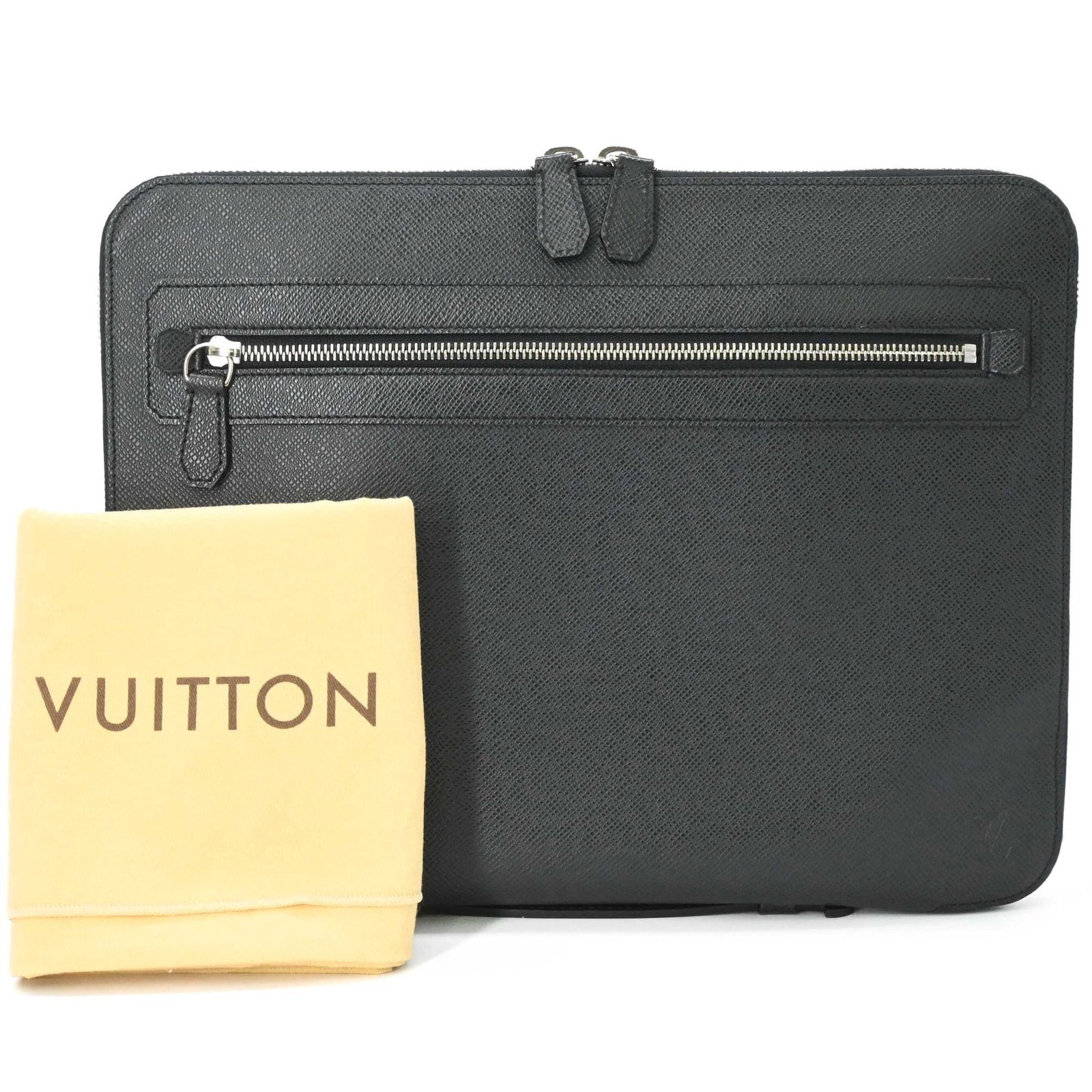 Vuitton Taiga Leather Clutch Bag: Vuitton Taiga Leather Clutch Bag Taiga leather craftsmanship meets timeless elegance in this Louis Vuitton clutch bag. Made from high-quality Taiga leather, its sleek black design exudes