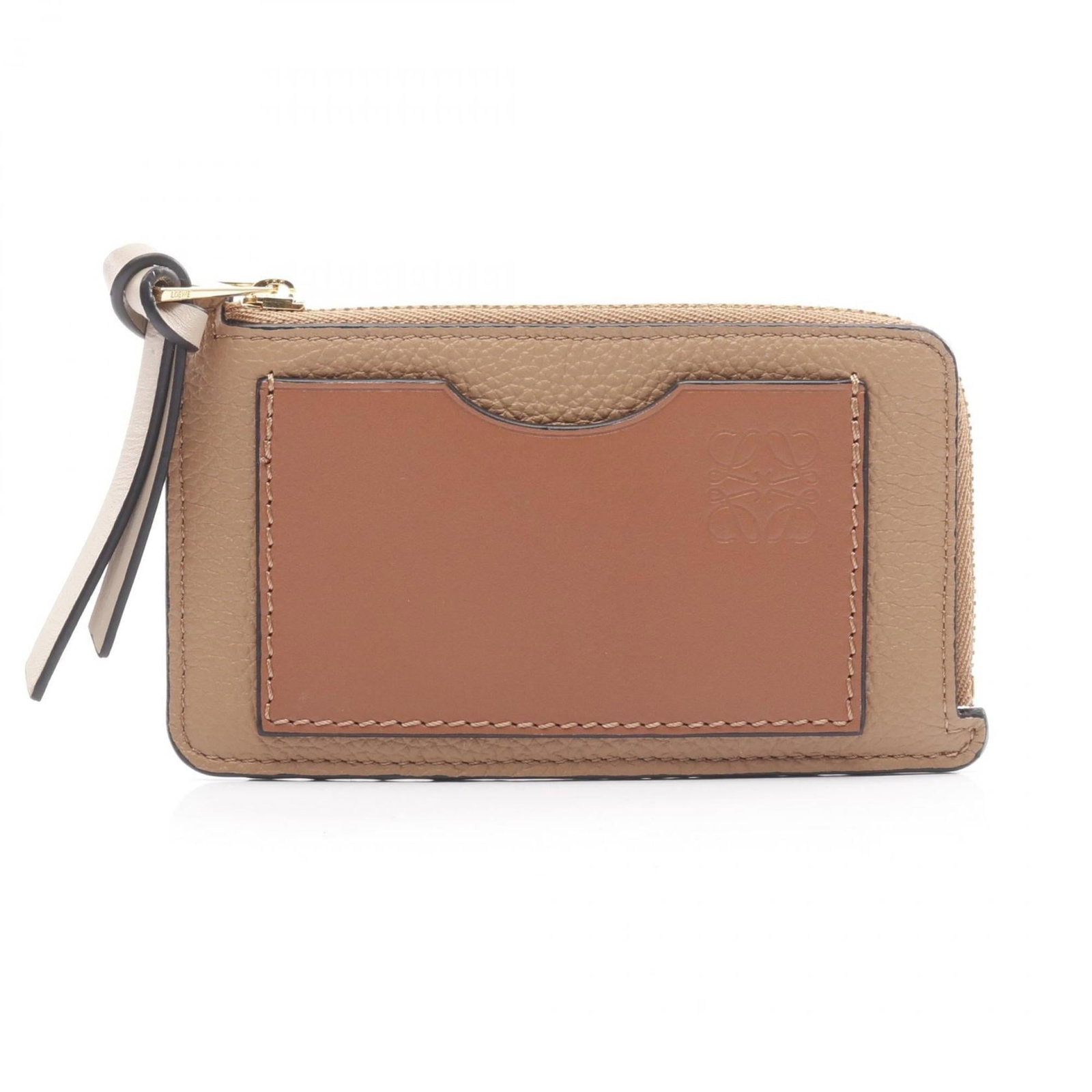 Loewe Coin Purse/ Coin Case Leather: Loewe Coin Purse/ Coin Case Leather The Loewe Coin Purse/ Coin Case Leather is a beautifully crafted brown leather accessory, measuring 7.5cm x 13cm x 1cm. Made from high-quality leather, this