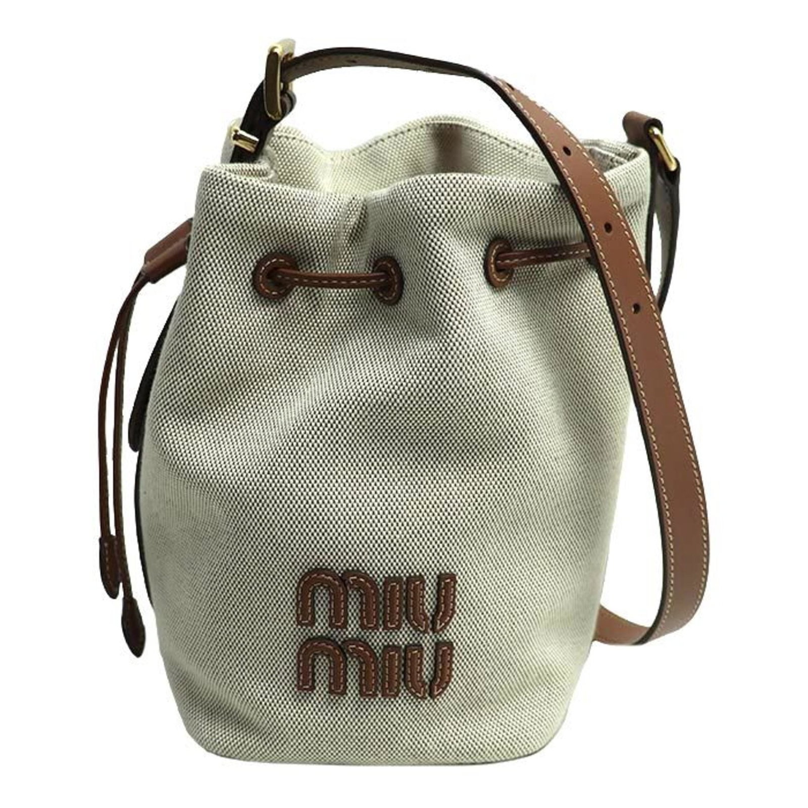 Canvas Leather Bag Shoulder Miu: Canvas Leather Bag Shoulder Miu Canvas Leather Bag Shoulder Miu is a stylish and versatile bag, featuring a canvas and leather construction, gold hardware, and a spacious interior. Measuring 22cm x