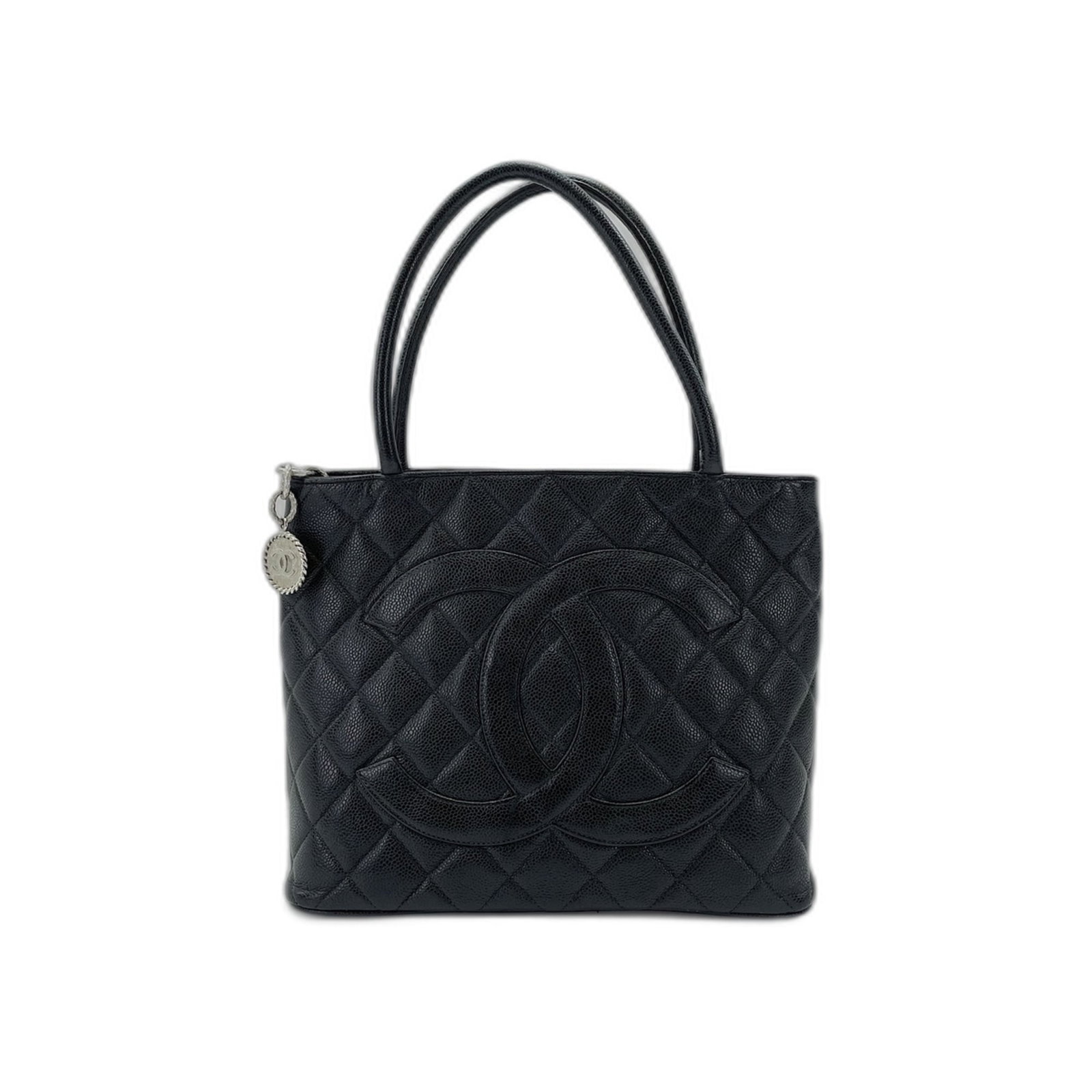 Chanel Tote Bag: Chanel Tote Bag The Chanel tote bag is a sleek and sophisticated black tote, measuring 23cm x 29cm x 14cm. Its classic design and timeless style make it a versatile accessory for everyday use. With a