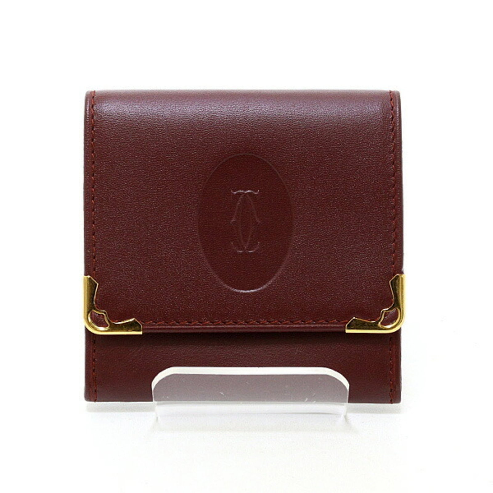 Coin Case Leather Purse Cartier: Coin Case Leather Purse Cartier Cartier's iconic coin purse is a timeless accessory, featuring a sleek Bordeaux leather design. This compact, 8cm x 8cm x 1.3cm purse is perfectly sized for storing