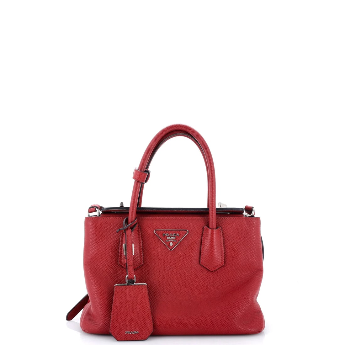 Saffiano Leather Mini Cuir Turnlock Twin Prada: Saffiano Leather Mini Cuir Turnlock Twin Prada Saffiano Leather Mini Cuir Turnlock Twin Prada features a striking red exterior with heavy corner wear, scuffs, cracking, and edge wear, giving it a uniq