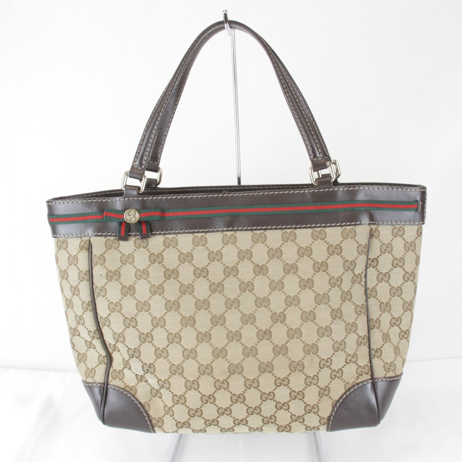 Canvas Leather Gucci Bag Tote: Canvas Leather Gucci Bag Tote GG canvas and leather come together in this classic Gucci tote, a timeless design that exudes Italian elegance. Measuring 25cm x 32cm x 11.5cm, it's the perfect size for