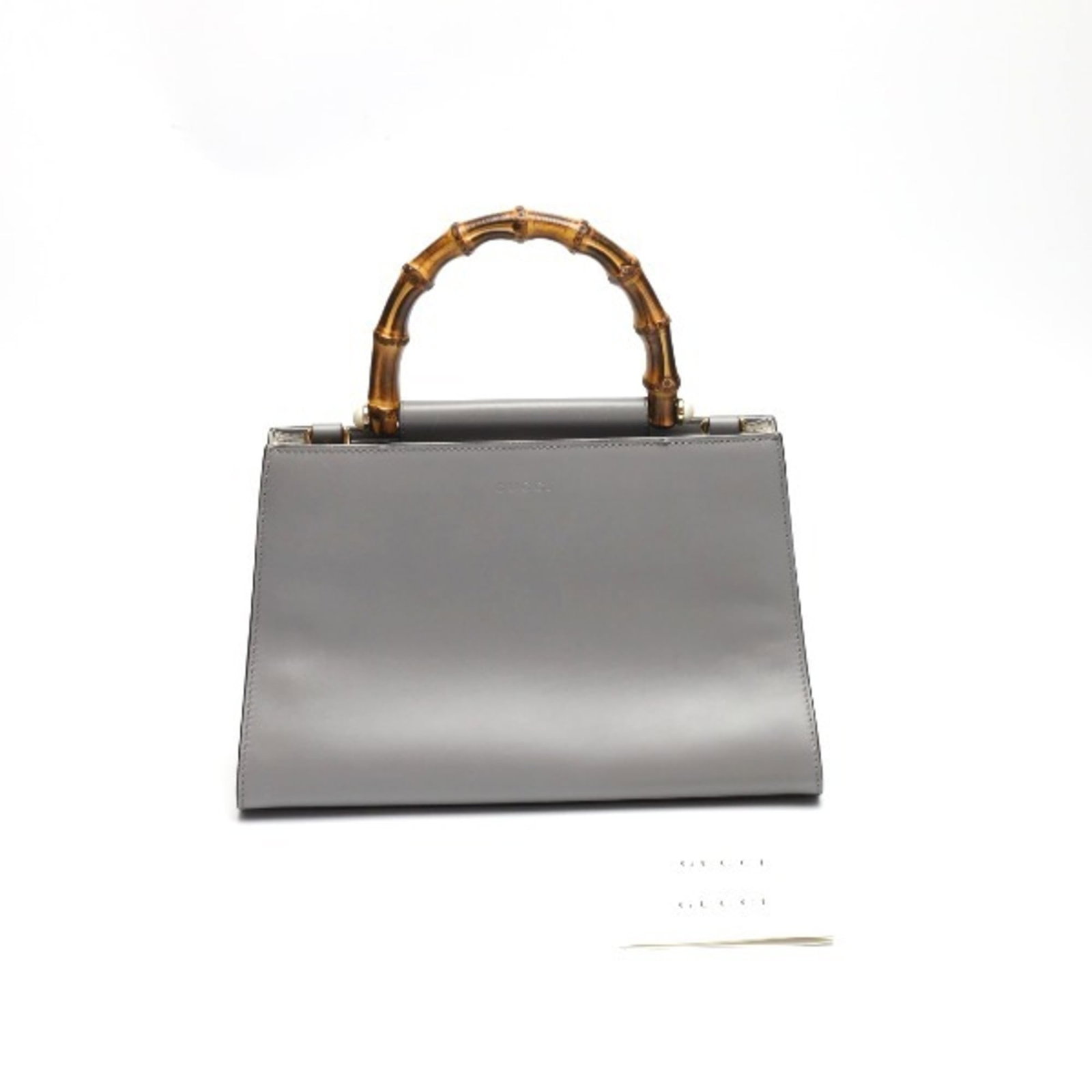 Handbag Bamboo: Handbag Bamboo The Gucci Handbag Bamboo is a unique and stylish accessory, crafted from sustainable bamboo material. Its distinctive gray color and compact size make it a practical and versatile