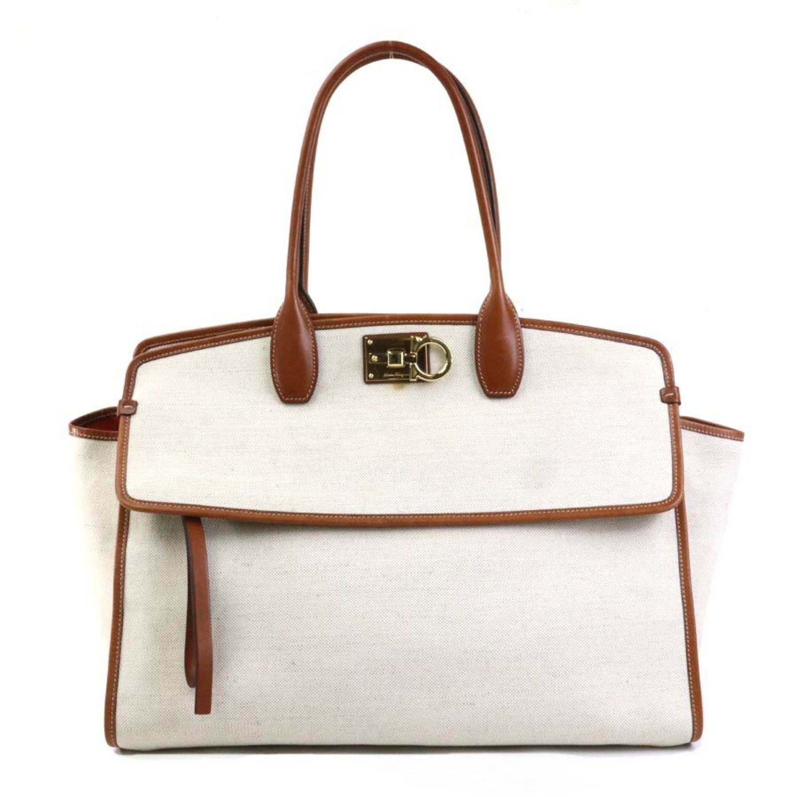 Canvas Leather Salvatore Ferragamo Handbag: Canvas Leather Salvatore Ferragamo Handbag Canvas Leather Salvatore Ferragamo Handbag - A stylish and versatile accessory, this brown canvas and leather handbag features a classic design with a