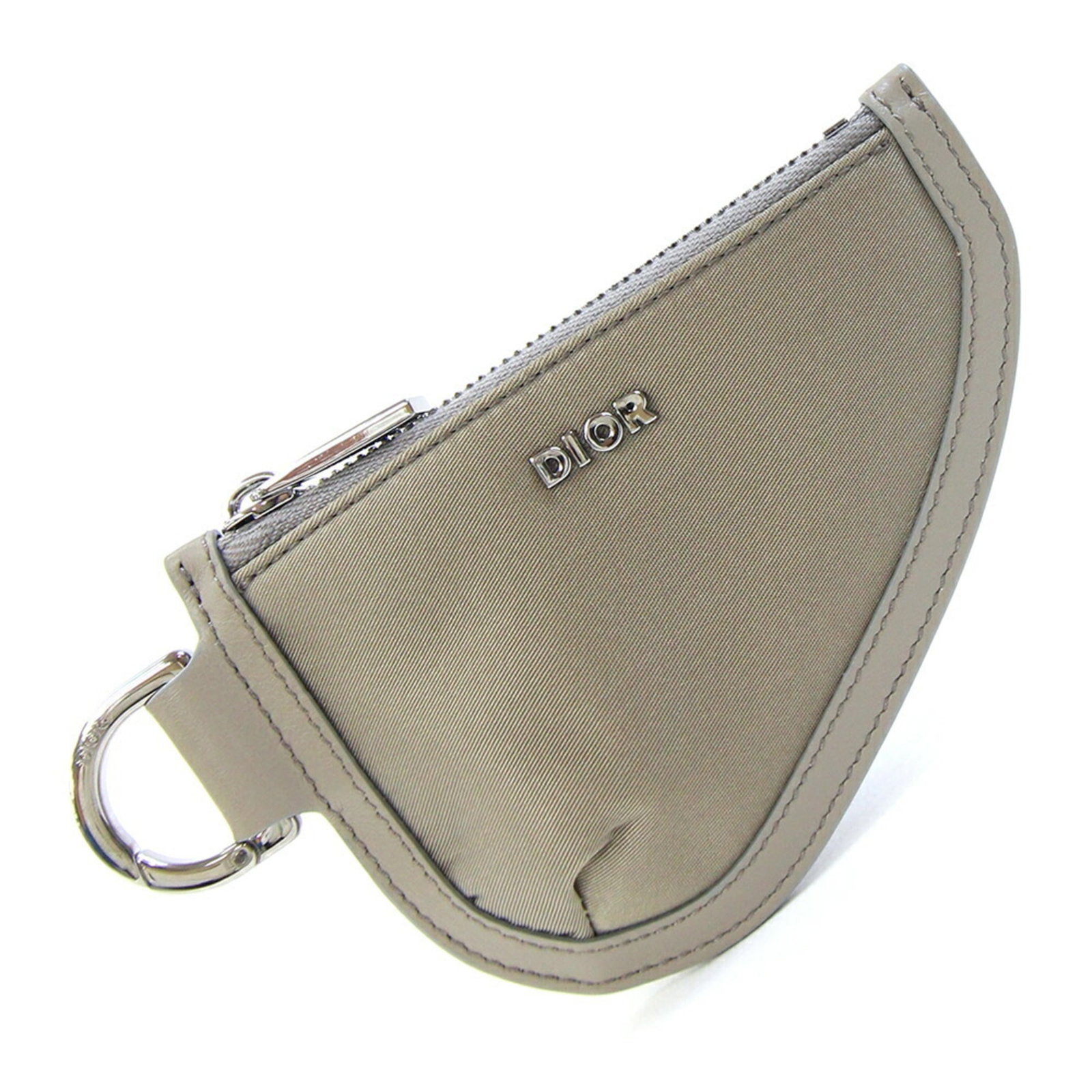 Coin Case Christian Dior Purse Leather Nylon: Coin Case Christian Dior Purse Leather Nylon Christian Dior's Coin Case is a stylish accessory made from a combination of nylon and leather, featuring a khaki color and a compact size. The Country of