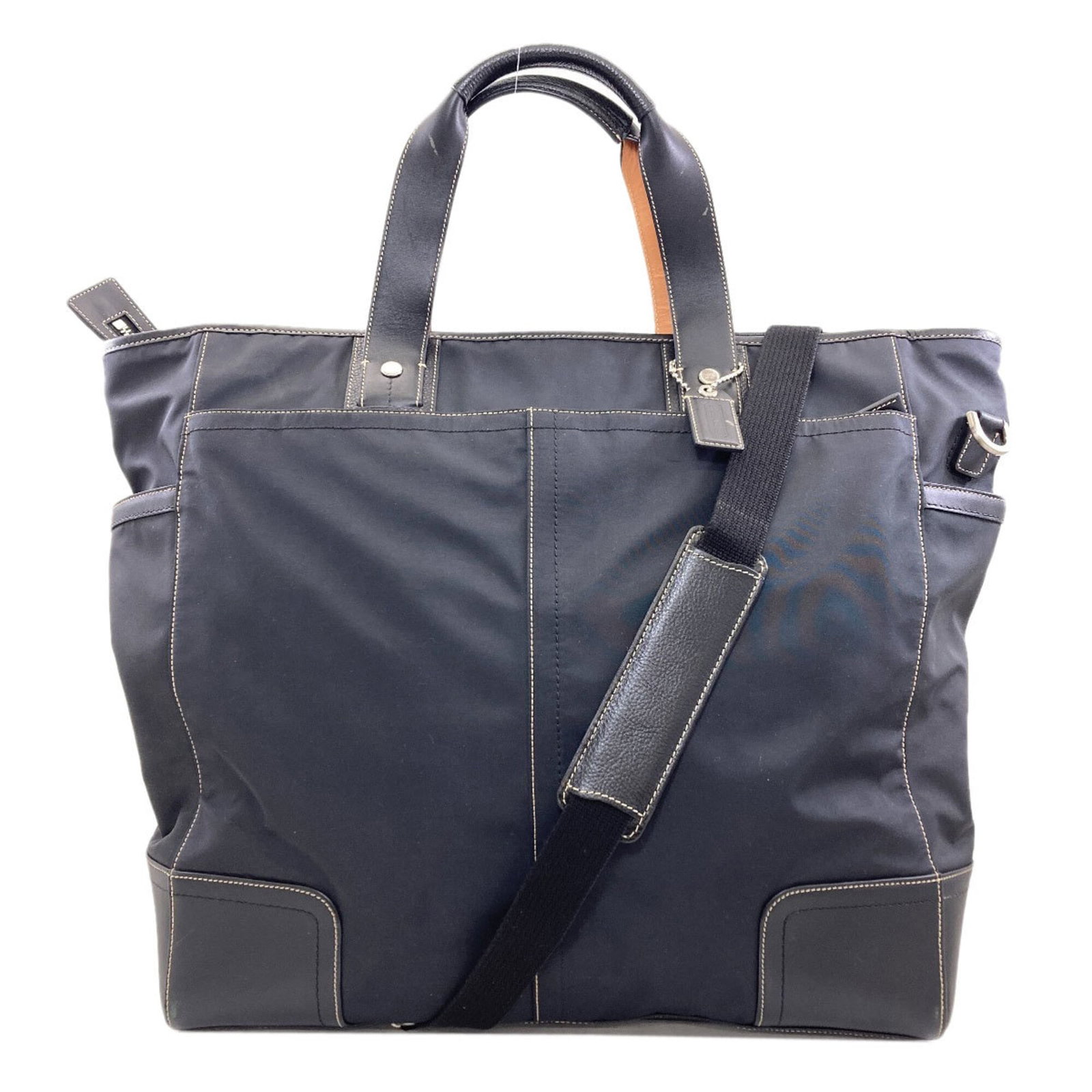 Tote Bag Nylon by Coach: Tote Bag Nylon by Coach Black nylon tote bag by Coach, measuring 39cm x 40cm x 16cm, providing a compact and versatile storage solution. Item Specifics: Brand: Coach Type: Tote bag Material: Nylon