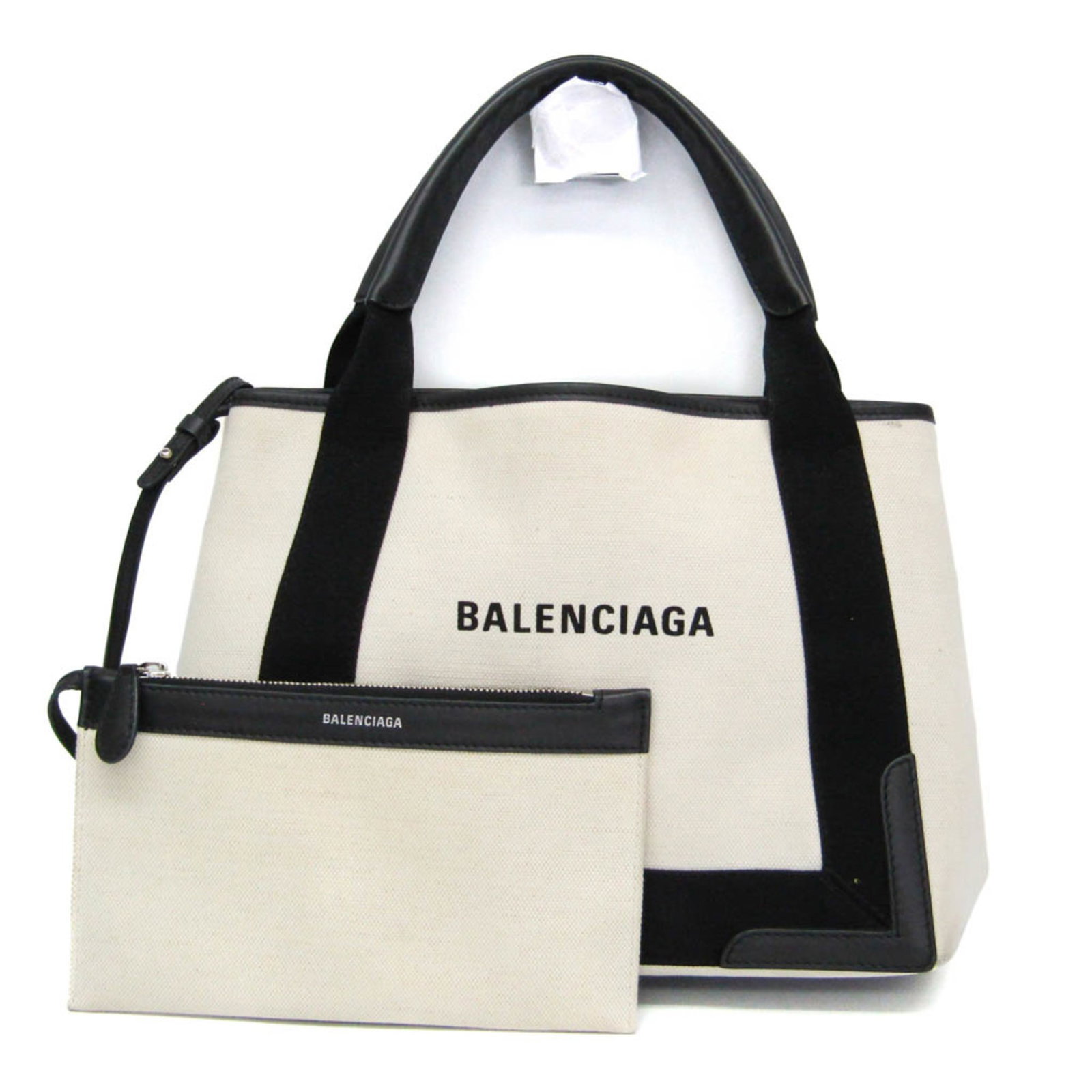 Canvas leather handbag by Balenciaga: Canvas leather handbag by Balenciaga Canvas leather handbag by Balenciaga, featuring a navy cabas design with off-white accents, boasts a sleek and modern look. With a spacious pouch size and sturdy