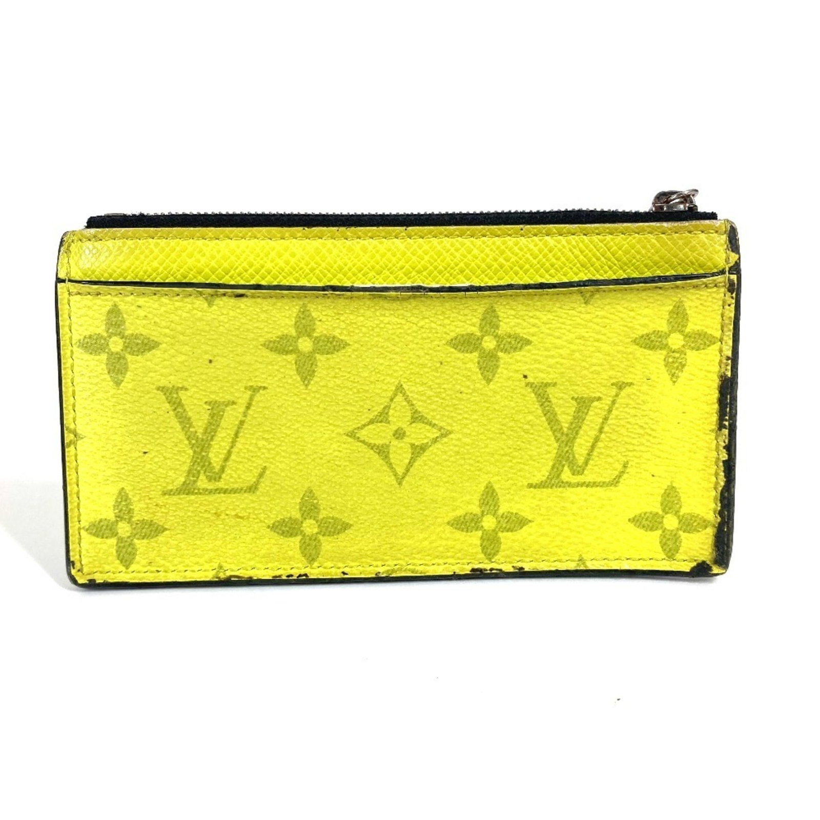 Louis Vuitton Coin Purse/ Coin Case Taigarama Monogram: Louis Vuitton Coin Purse/ Coin Case Taigarama Monogram Taigarama Monogram Coin Purse/ Coin Case by Louis Vuitton features a striking yellow color and iconic Monogram pattern, adding a touch of luxury