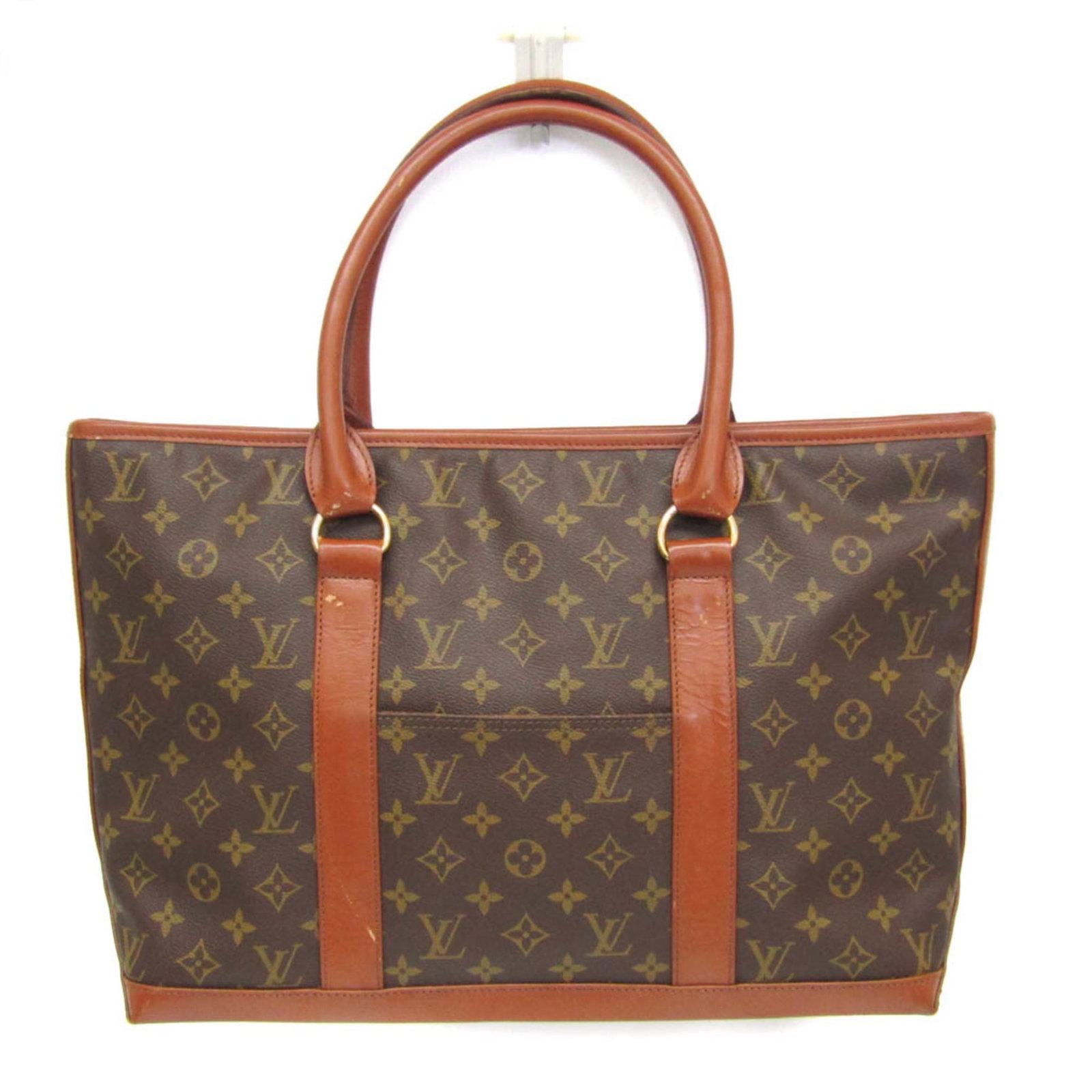 Louis Vuitton Monogram Handbag: Louis Vuitton Monogram Handbag The Louis Vuitton Monogram Sac Weekend PM is a stylish and functional handbag with a classic design. Featuring the iconic Monogram pattern, this bag boasts a spacious