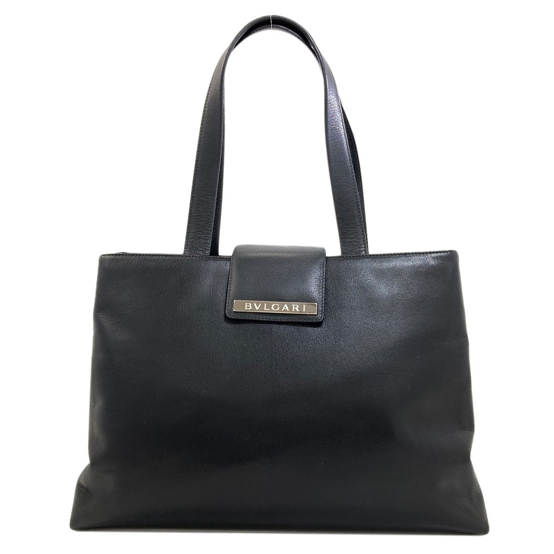 Logo Handbag Leather: Logo Handbag Leather Black leather handbag from BVLGARI, bearing the brand's signature style and color. Made from high-quality leather, this handbag is a classic design that exudes sophistication and 