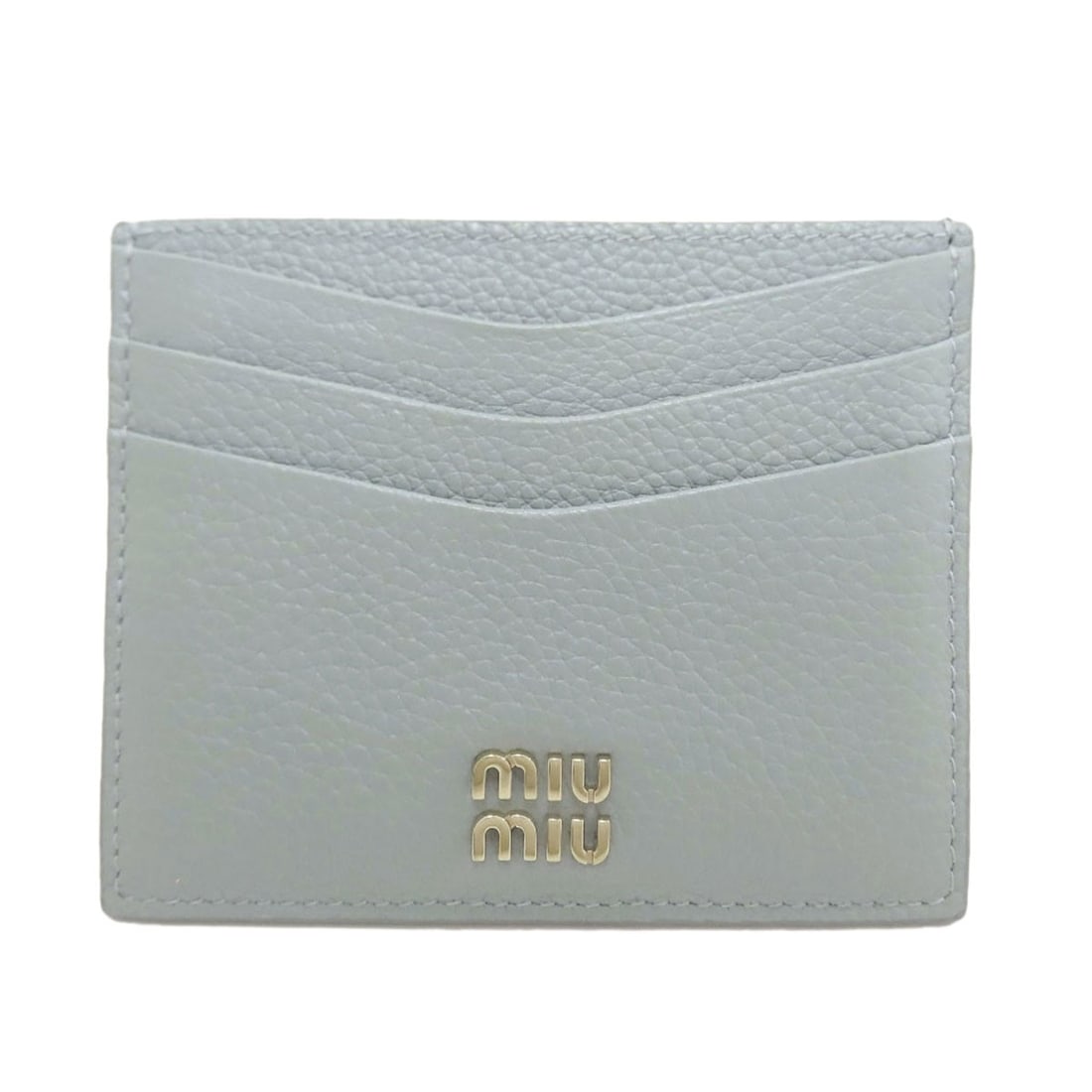 Miumiu Logo Card Case Leather: Miumiu Logo Card Case Leather Blue leather card case with MIUMIU logo. Made from high-quality leather, this card case features a striking blue exterior with the MIUMIU logo prominently displayed. Item