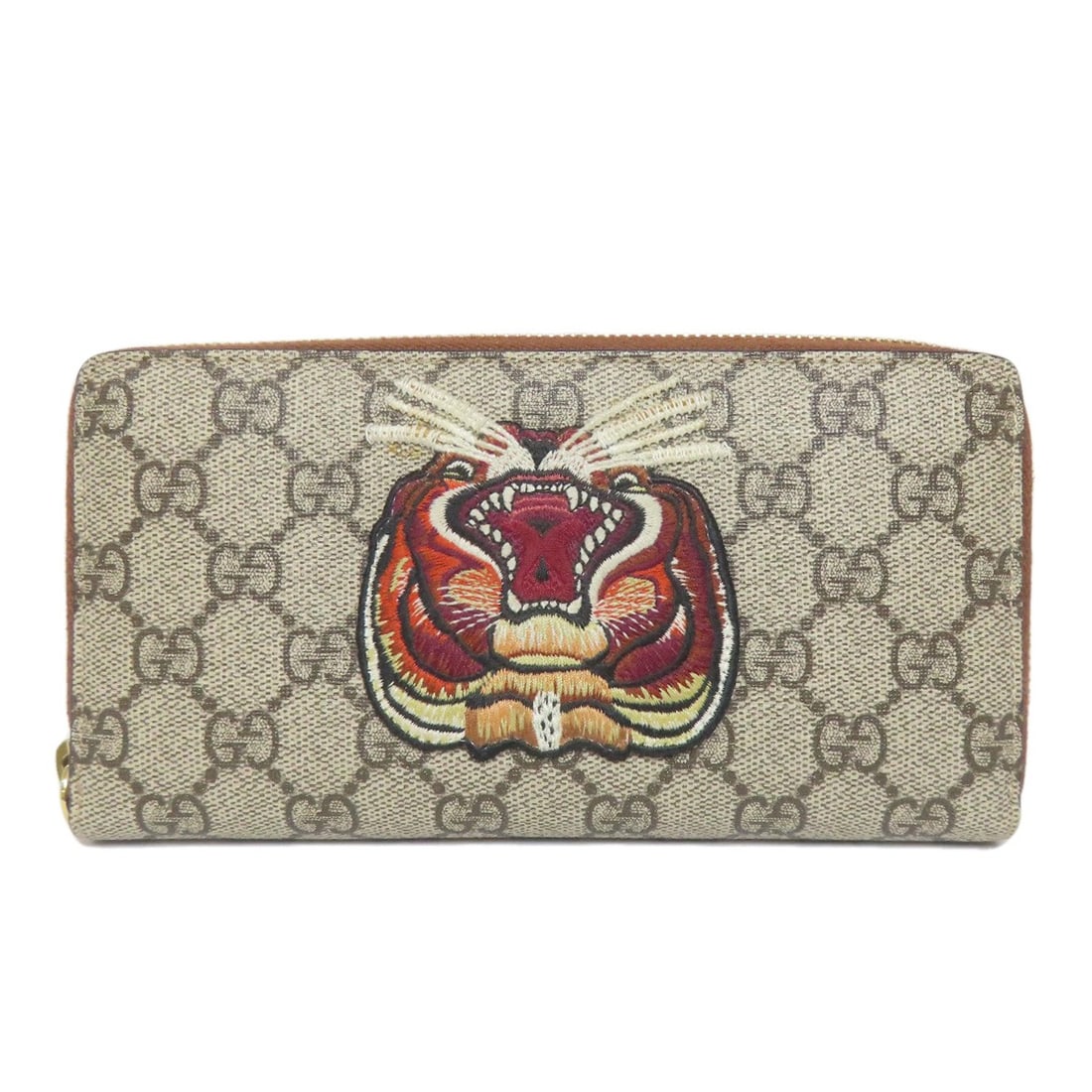 Tiger Long Supreme Gucci Pvc Wallet With Coin Gg 456863: Tiger Long Supreme Gucci Pvc Wallet With Coin Gg 456863 Brown PVC Long Wallet with Coin Pocket from GUCCI. This stylish wallet features a signature and a coin pocket, adding a touch of luxury to your 