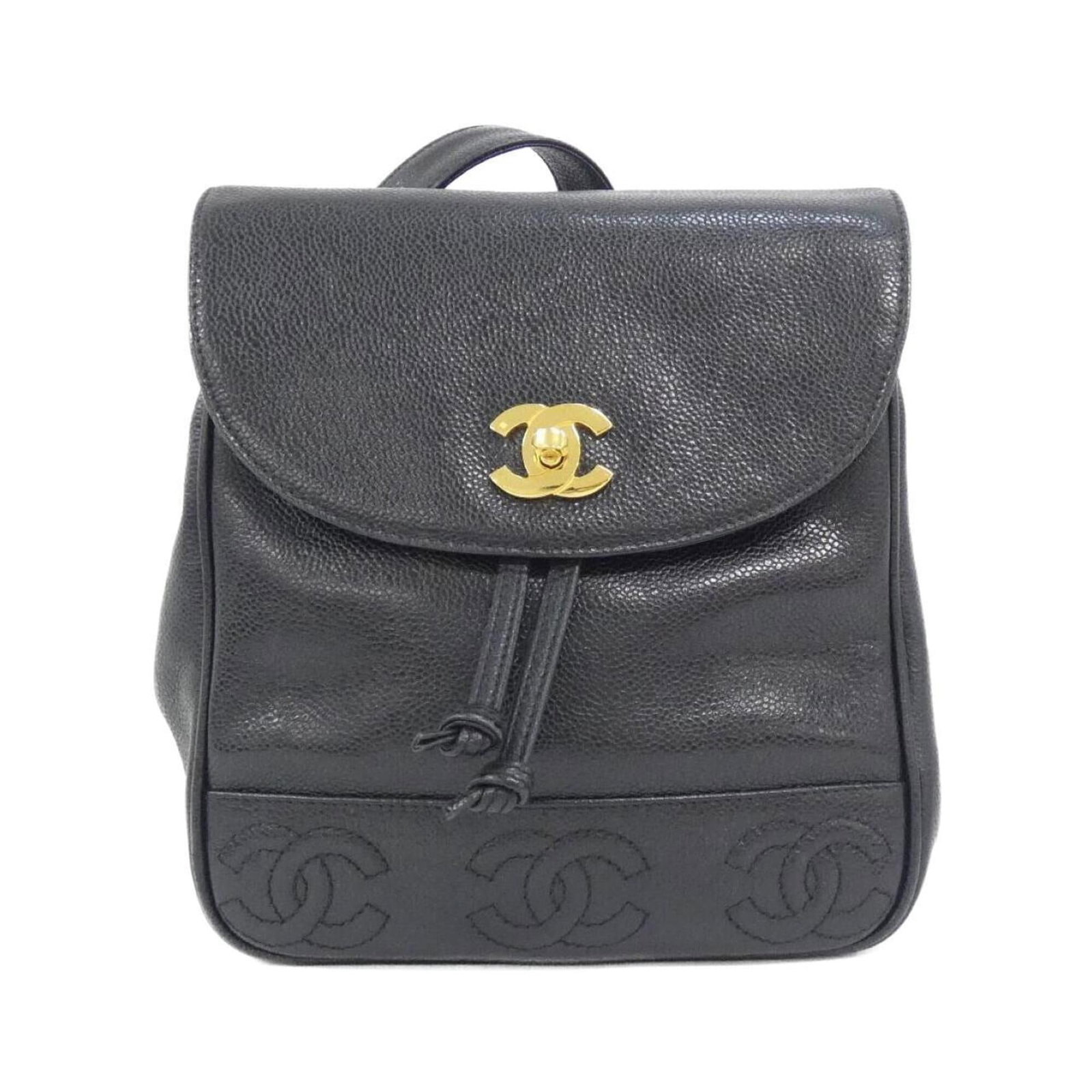 Calfskin Grained Chanel Backpack: Calfskin Grained Chanel Backpack Grained calfskin gives this Chanel backpack a luxurious feel, while gold hardware adds a touch of sophistication. Made from high-quality materials, this black