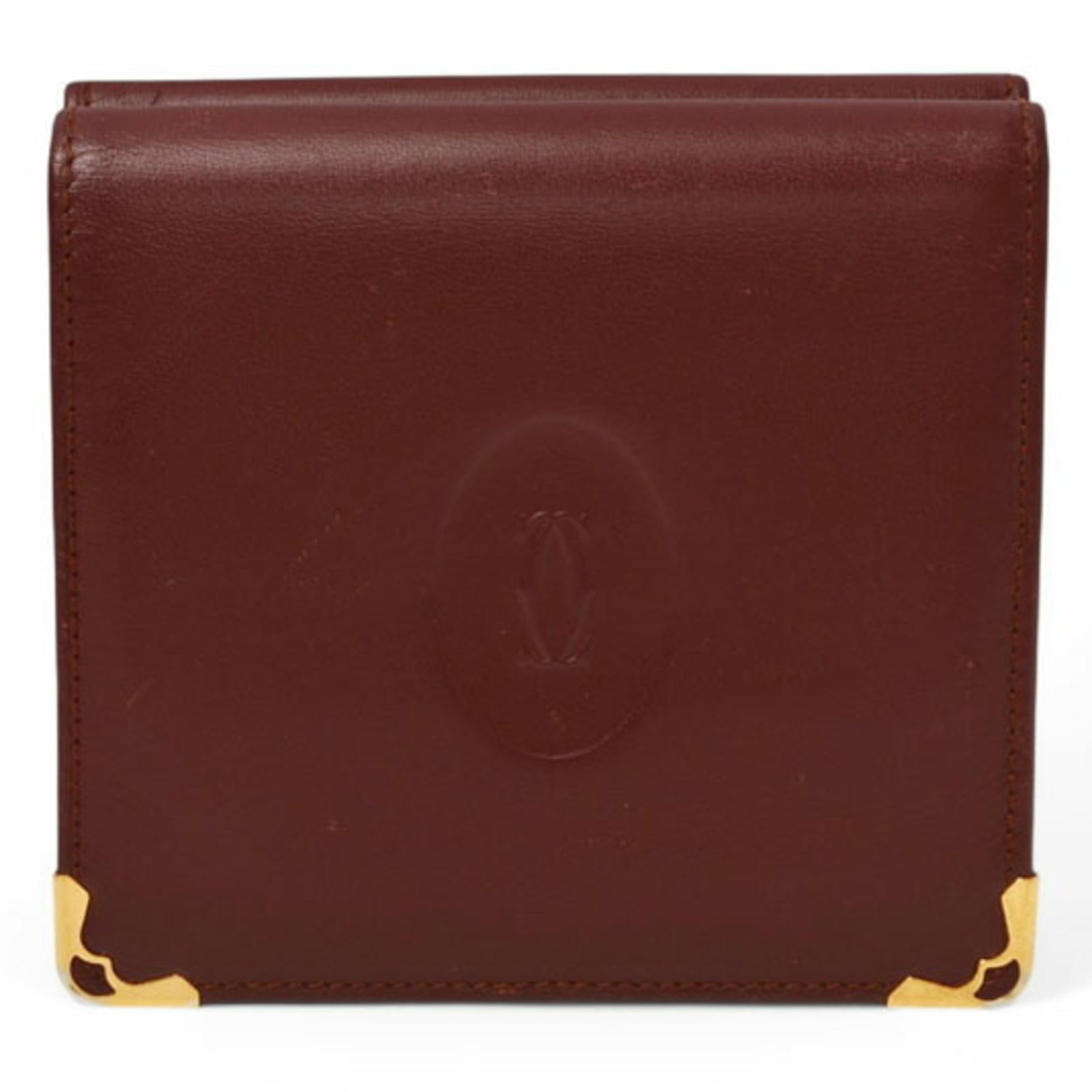 Cartier Wallet (Bi-Fold) Leather: Cartier Wallet (Bi-Fold) Leather Bordeaux leather Cartier bi-fold wallet, measuring 9.5cm x 10cm x 2cm, is a stylish accessory made from high-quality leather. This elegant wallet features a classic de