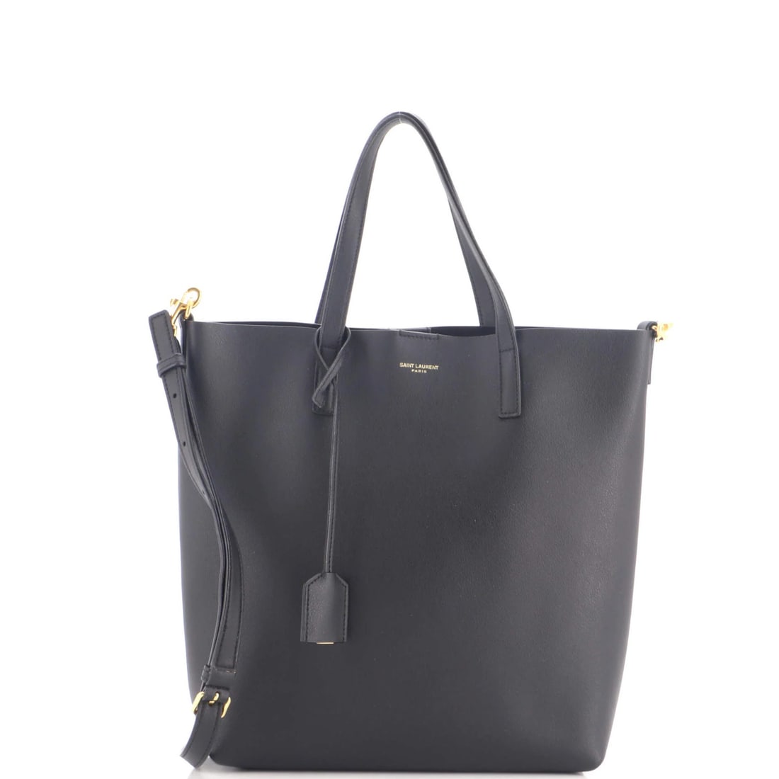 Toy Leather Tote Shopper Saint: Toy Leather Tote Shopper Saint Black leather Saint Laurent Shopper Tote measures 11" tall, 9" wide, and 3" deep. The exterior shows signs of wear, including scuffs, edge wear, and minor creases,