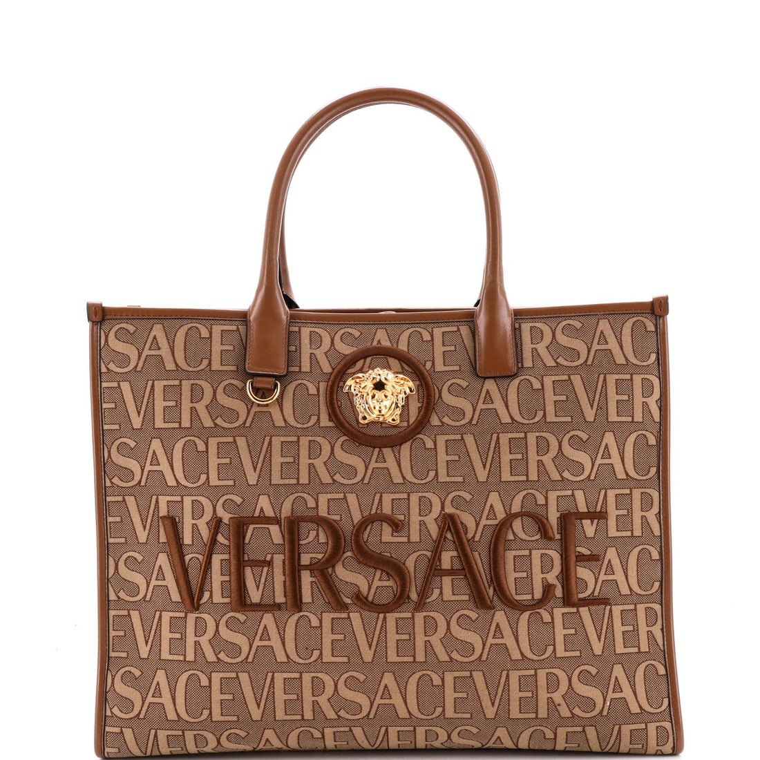 Versace Allover Medusa Tote Printed Jacquard Canvas Large: Versace Allover Medusa Tote Printed Jacquard Canvas Large Versace's iconic Allover Medusa Tote is a statement piece, boasting a striking printed Jacquard canvas design. Measuring 12" x 15.5" x 6.5",