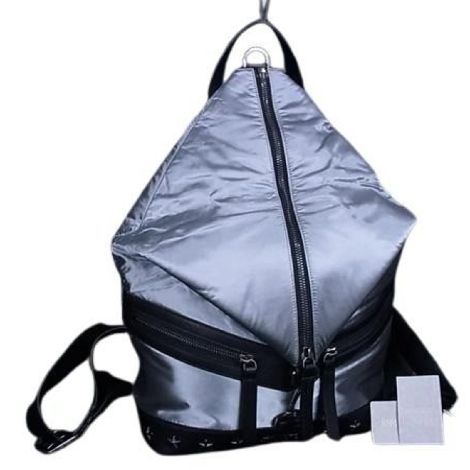 Backpack Handbag Leather Nylon Shoulder Bag By Jimmy Choo: Backpack Handbag Leather Nylon Shoulder Bag By Jimmy Choo Black and silver nylon and leather backpack handbag with two zipper pockets, perfect for everyday use. This versatile shoulder bag features a