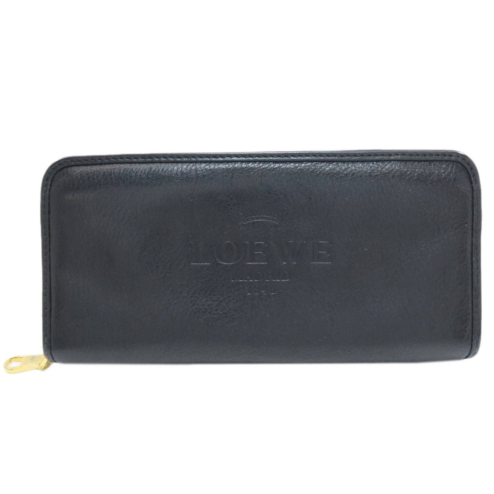 Leather Bi Fold Long Wallet: Leather Bi Fold Long Wallet Black leather bi-fold long wallet with a zipper closure, measuring 9cm x 19cm x 2cm. This sleek design offers a classic and timeless look, perfect for everyday use. Made