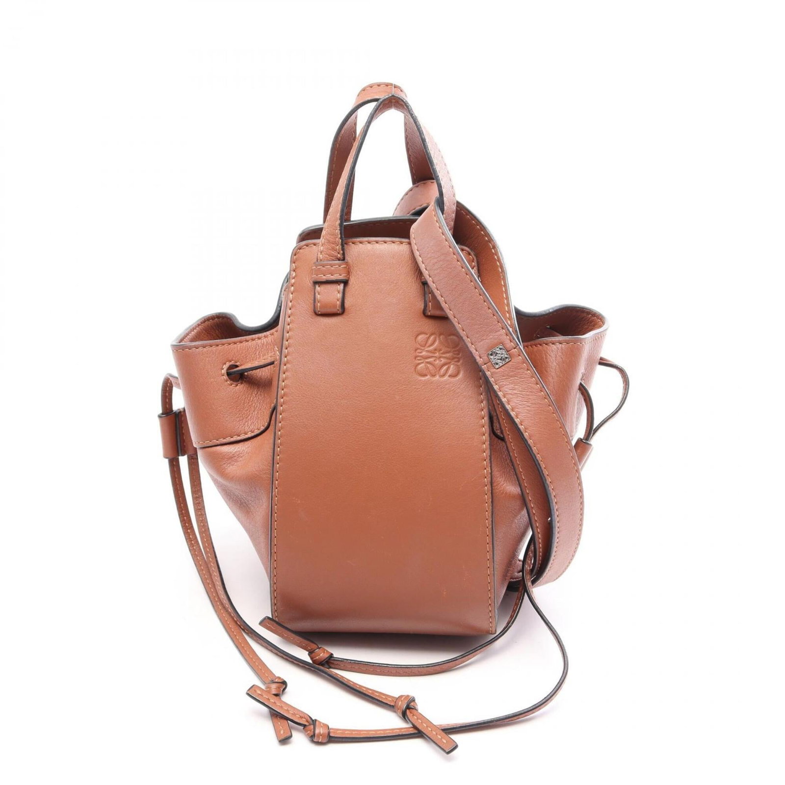 Handbag Leather Handbag: Handbag Leather Handbag This beautifully crafted leather handbag is made from high-quality leather and features a classic brown color. With its compact size and sleek design, it's perfect for