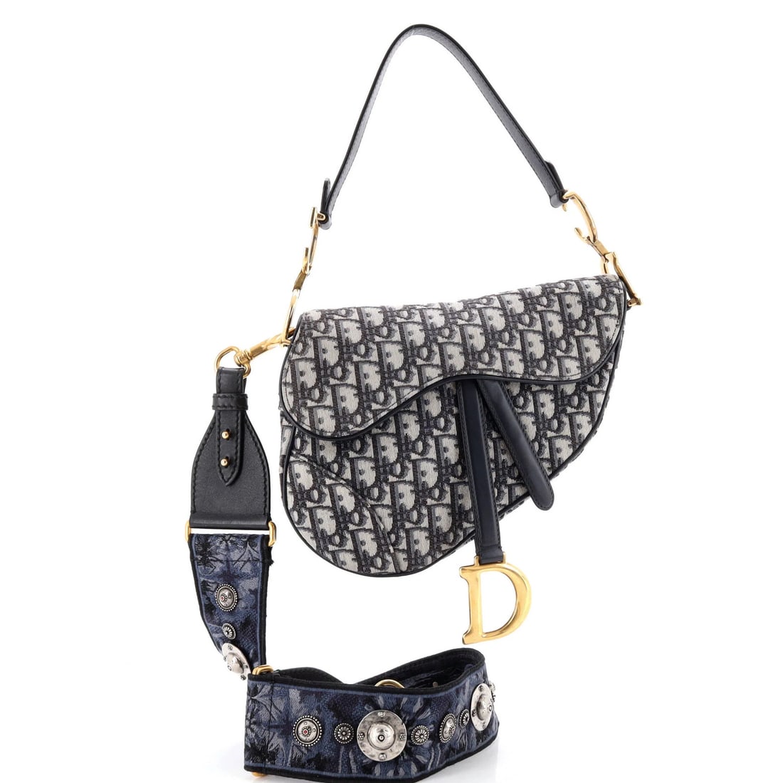 Christian Dior Saddle Handbag Canvas Oblique Medium Strap with: Christian Dior Saddle Handbag Canvas Oblique Medium Strap with Canvas Oblique Medium Strap Saddle Handbag in Blue. This Christian Dior medium strap shoulder bag features a classic oblique design and a