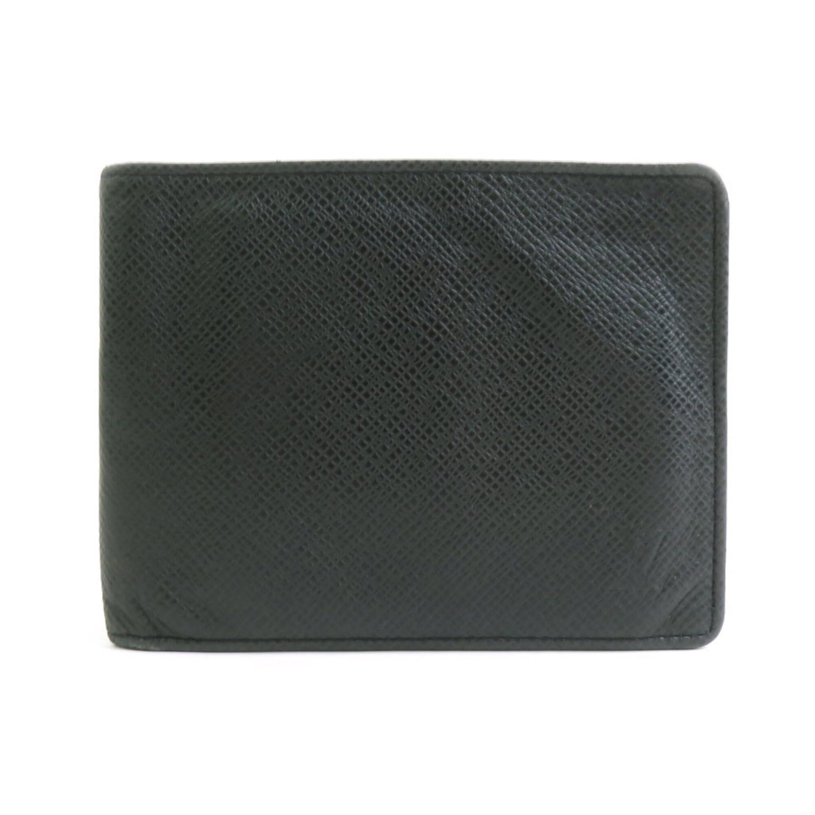 Louis Vuitton Wallet (Bi-Fold) Taiga Leather: Louis Vuitton Wallet (Bi-Fold) Taiga Leather Taiga leather gives this bi-fold wallet its distinctive texture and depth, while its sleek black color makes it versatile for everyday use. Measuring 9.8cm