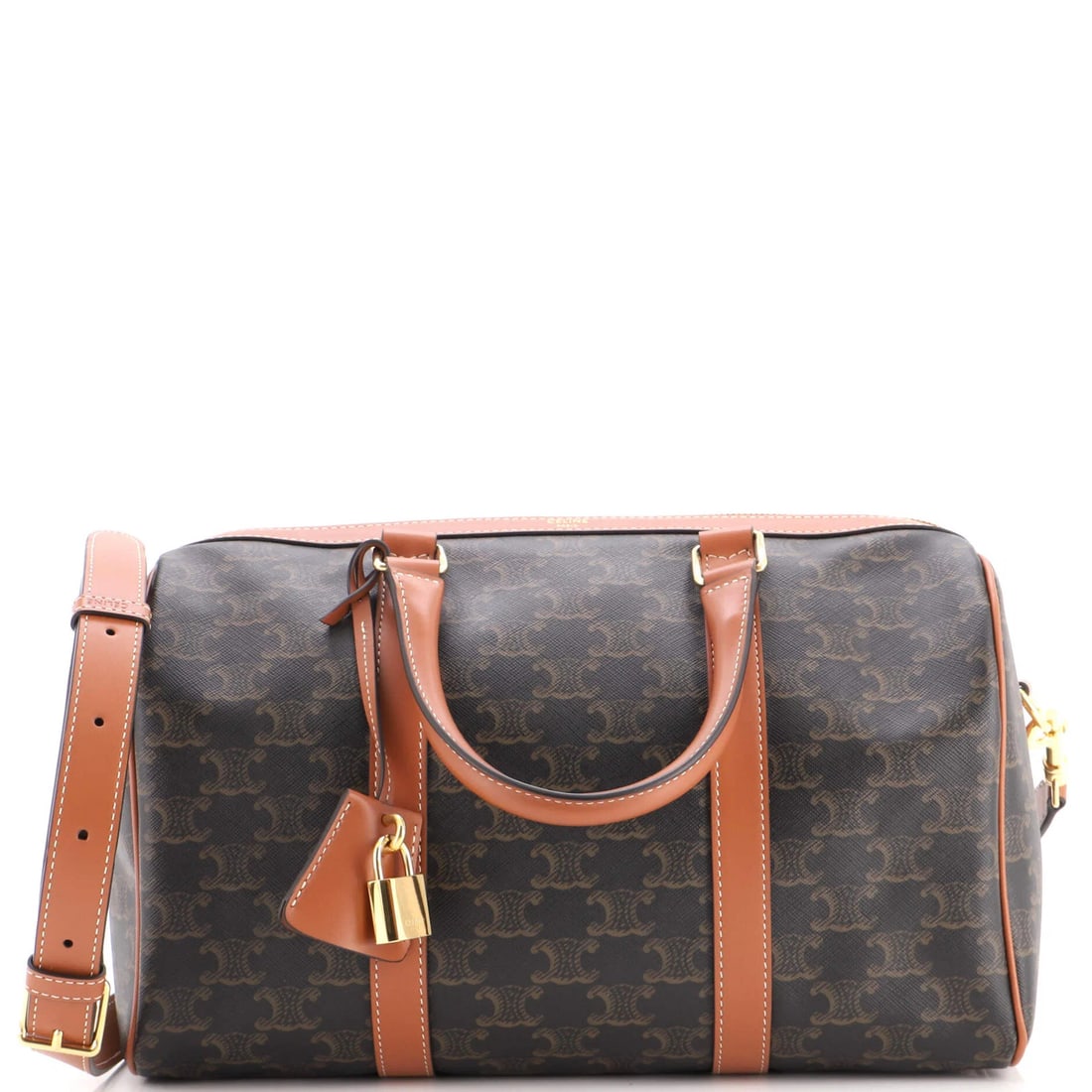 Triomphe Coated Large Celine Boston Bag: Triomphe Coated Large Celine Boston Bag The Triomphe Coated Large Celine Boston Bag boasts a rich, brown canvas exterior with subtle leather accents, perfectly balanced by the elegant bowler design.