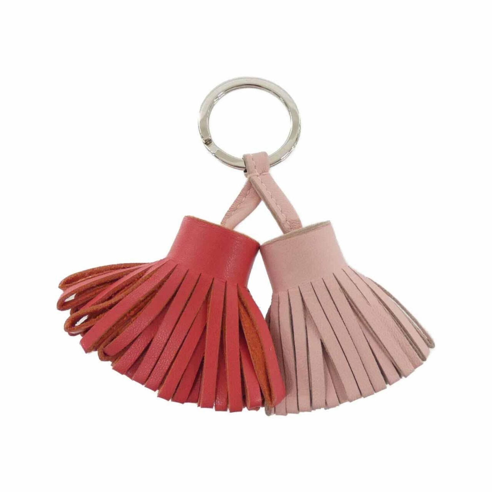 Keyring Agneau Milo Hermes: Keyring Agneau Milo Hermes Agneau Milo is a luxurious material used in this rose-colored keyring from Hermes. The subtle sheen and soft texture of Agneau Milo add a touch of elegance to this