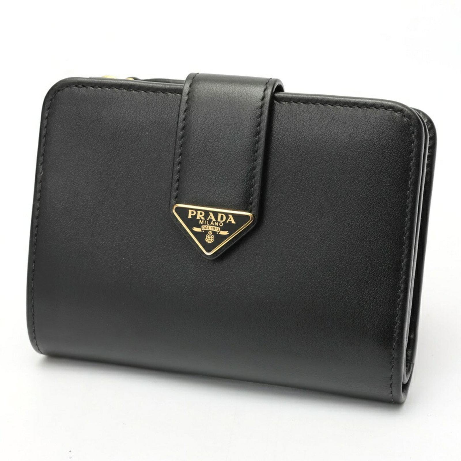 Bi fold leather wallet: Bi fold leather wallet Bi-fold leather wallet from Prada, crafted from high-quality black leather, measures 9cm x 12cm x 2cm. This sleek and compact wallet features a classic bi-fold design, perfect