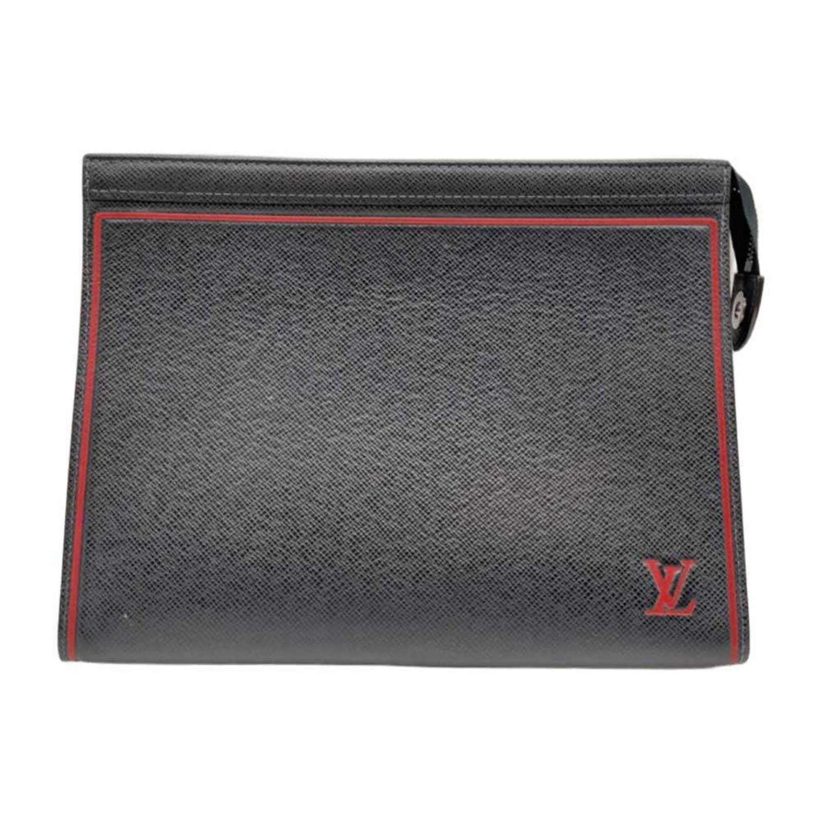 Vuitton Taiga Leather Clutch Bag: Vuitton Taiga Leather Clutch Bag Taiga leather craftsmanship is on full display in this navy-clad clutch bag, boasting a sleek 20cm x 27cm x 6cm design that makes a statement. The Taiga line is known 