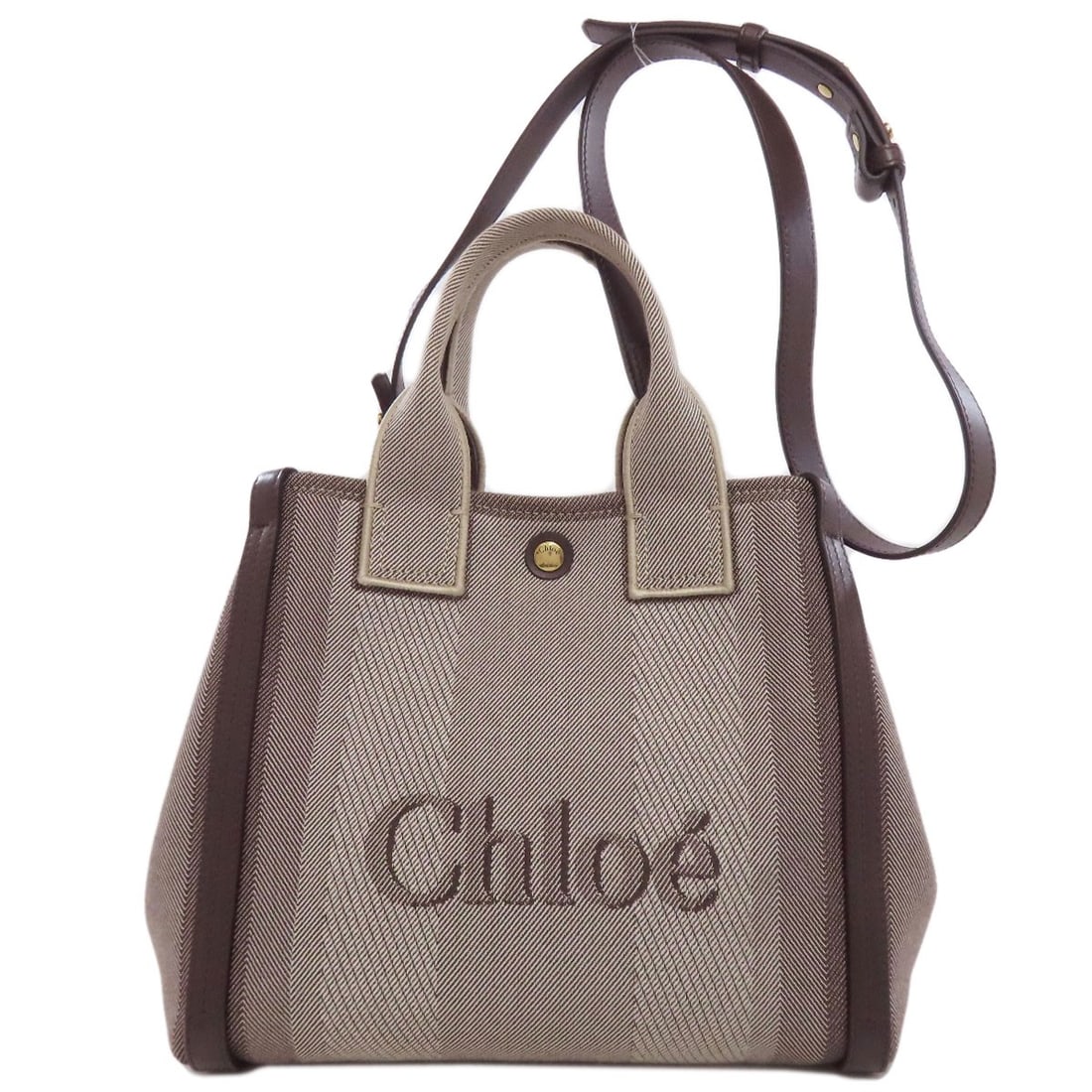Canvas Carry Small Handbag Chloe: Canvas Carry Small Handbag Chloe Canvas Carry Small Handbag Chloe is made from canvas and features a brown exterior color. This stylish handbag is a classic design that combines functionality with a t