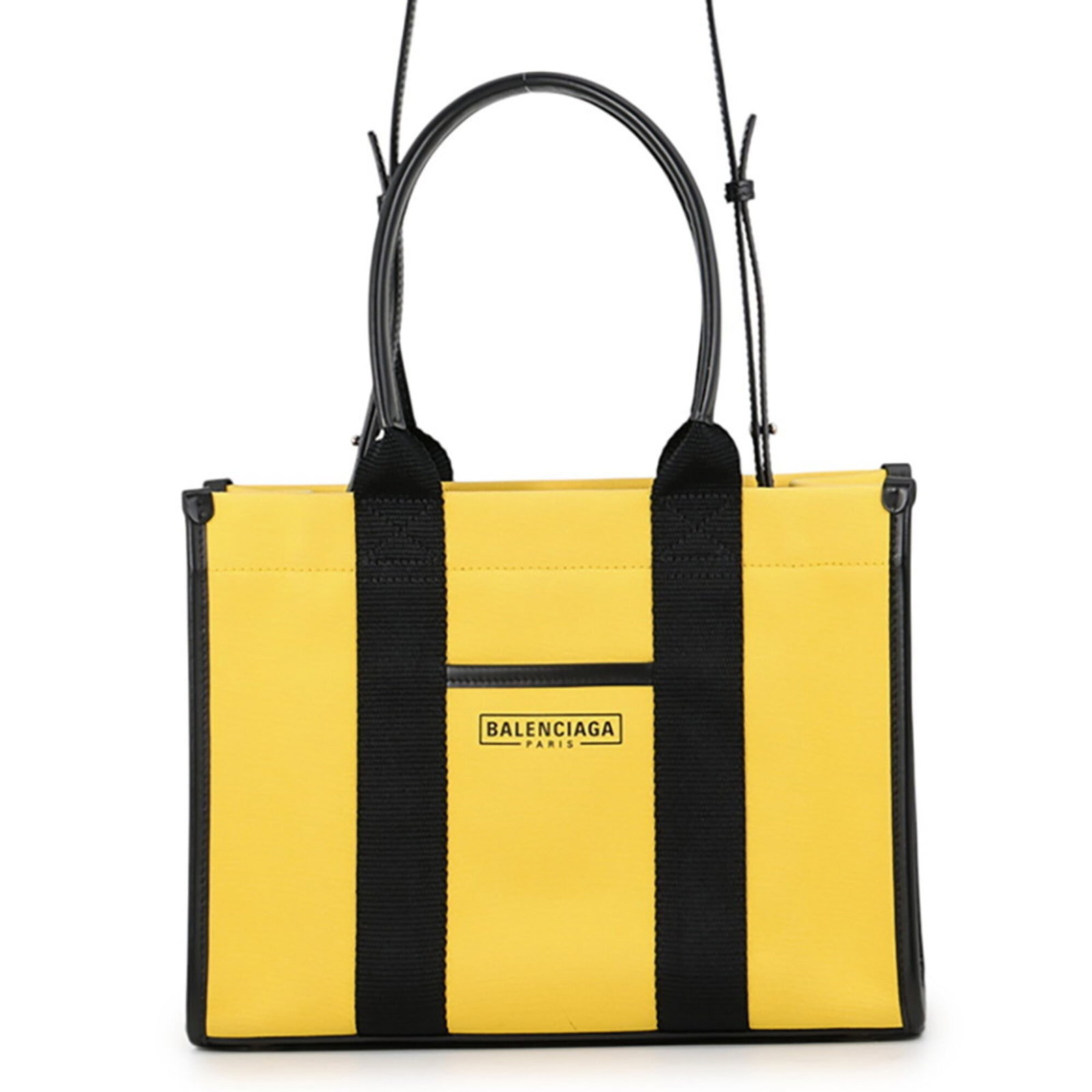 Canvas leather handbag by Balenciaga: Canvas leather handbag by Balenciaga Canvas leather handbag by Balenciaga, featuring a sleek black and yellow color combination, an open zipper pocket and open outer pocket, and a sturdy canvas and