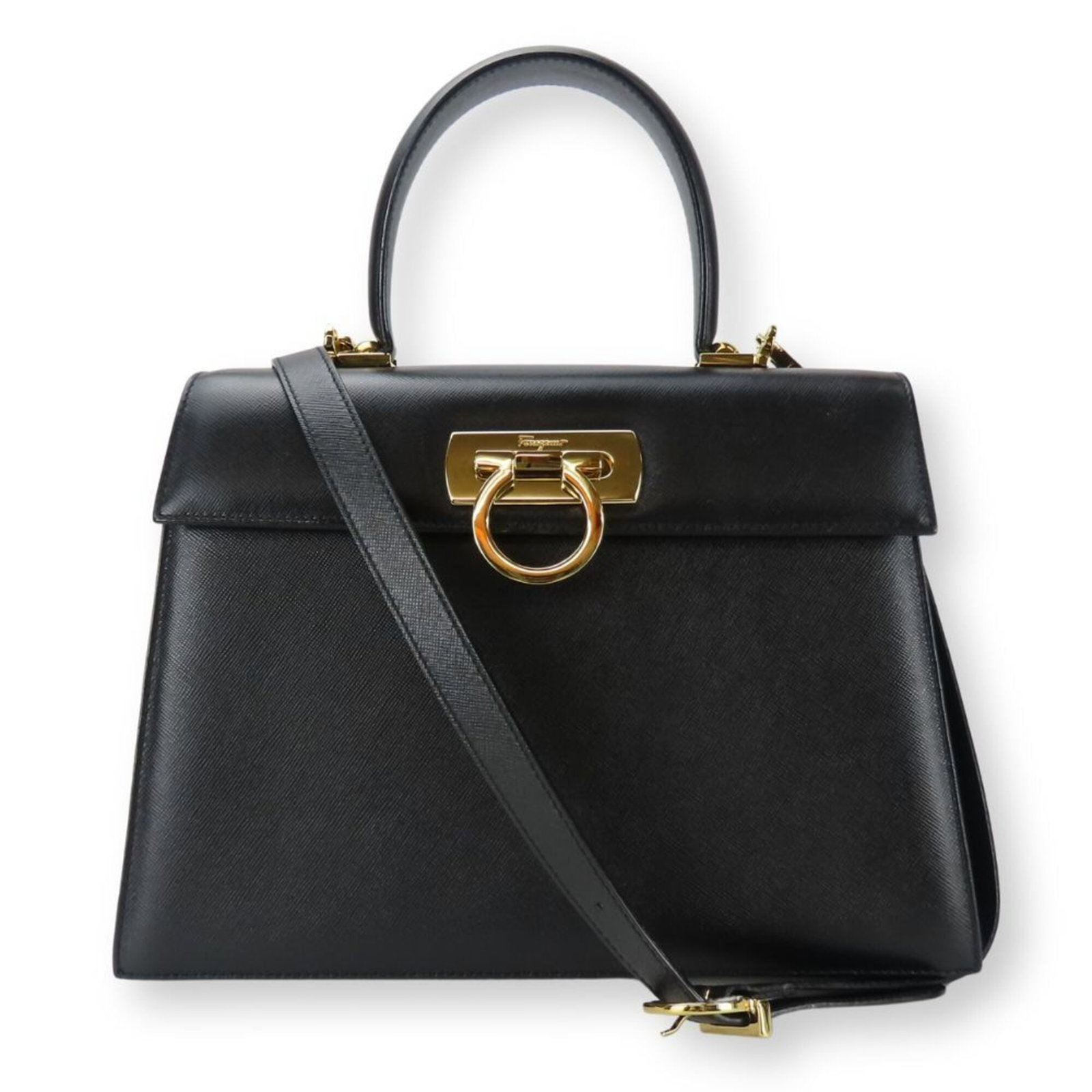 Salvatore Ferragamo Handbag Leather: Salvatore Ferragamo Handbag Leather Black Salvatore Ferragamo Gancini Handbag made from high-quality leather, featuring a turn lock closure and adjustable strap length. This stylish handbag measures 1