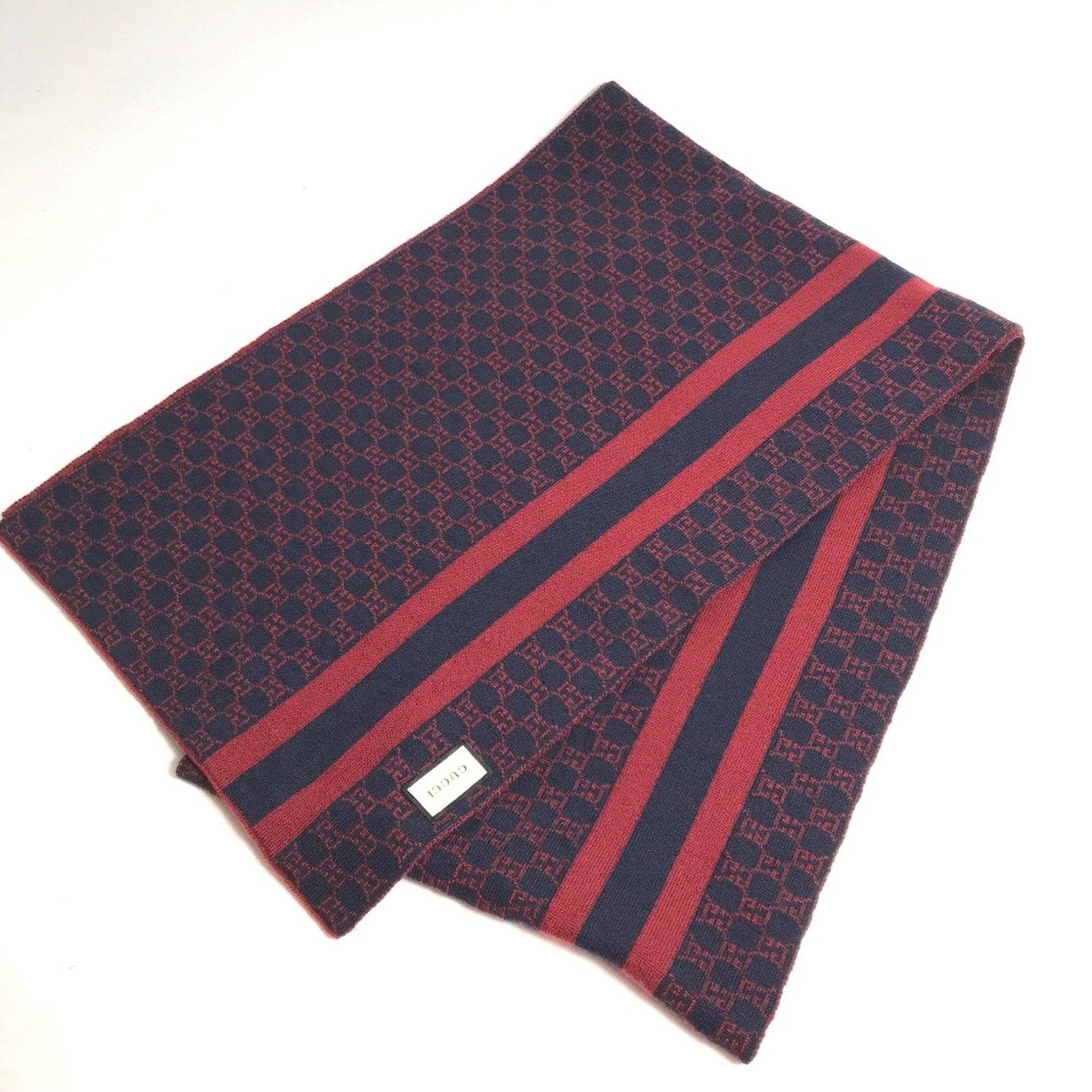 Stole Wool from Gucci: Stole Wool from Gucci Stole Wool from Gucci is a vibrant red wool stole with a size of W12.2 x H75.6inch / W31cm x H192cm. This striking piece boasts a unique combination of color and material,