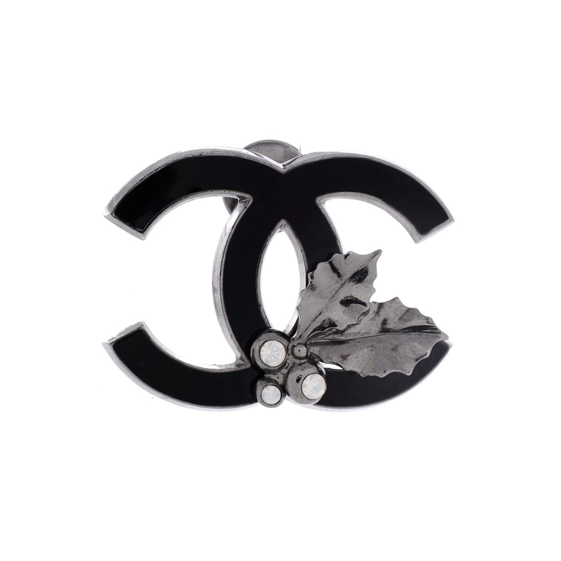 Holly CC Metal Brooch Pin Chanel with Enamel and Crystals: Holly CC Metal Brooch Pin Chanel with Enamel and Crystals The Holly CC Metal Brooch Pin Chanel is a stunning piece featuring crystal, enamel, and silver details. Its intricate design and striking