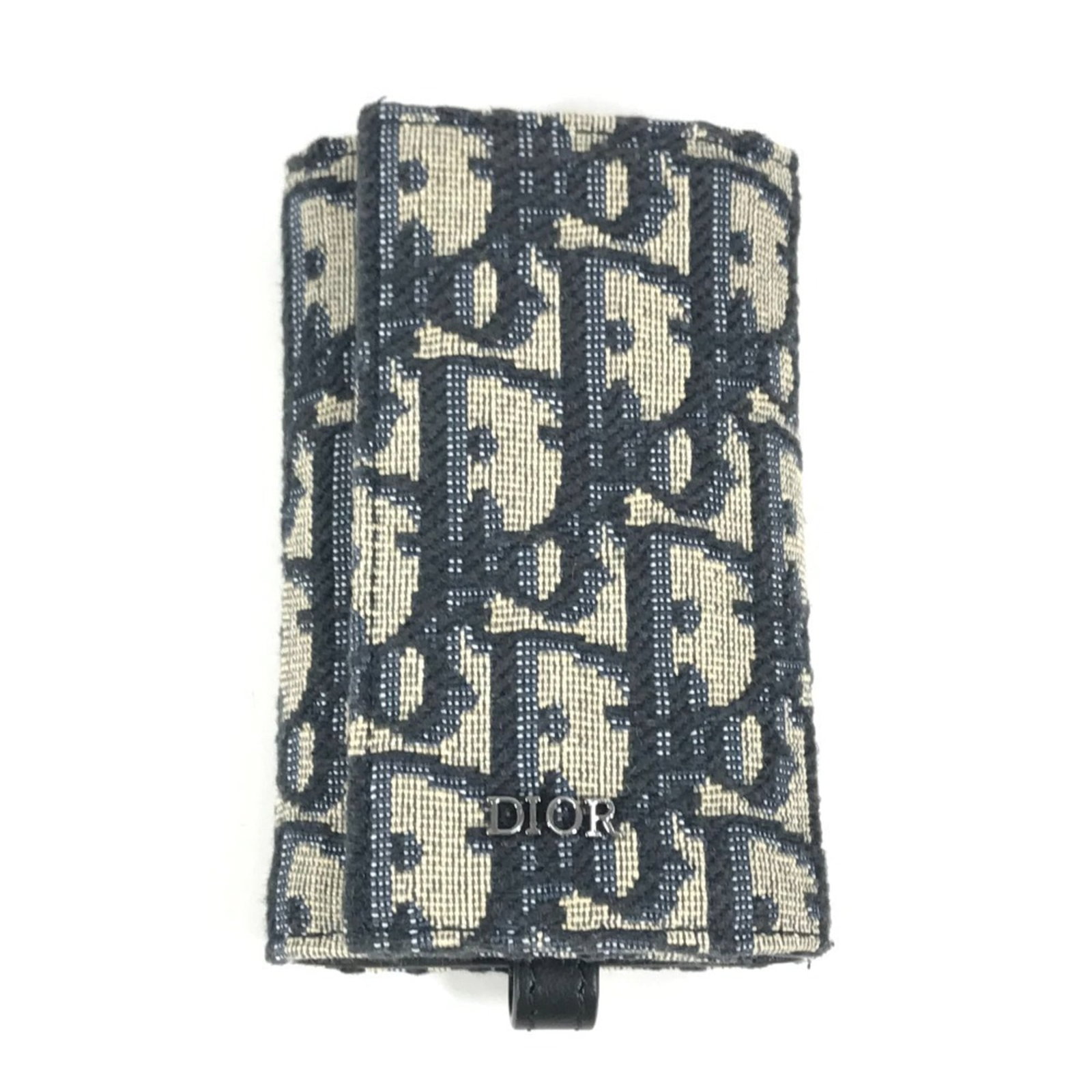Keycase Canvas Leather Dior Christian: Keycase Canvas Leather Dior Christian Canvas and leather come together in a classic design, with a navy color that adds a touch of sophistication. The 10.5cm x 7cm keycase is made from a combination
