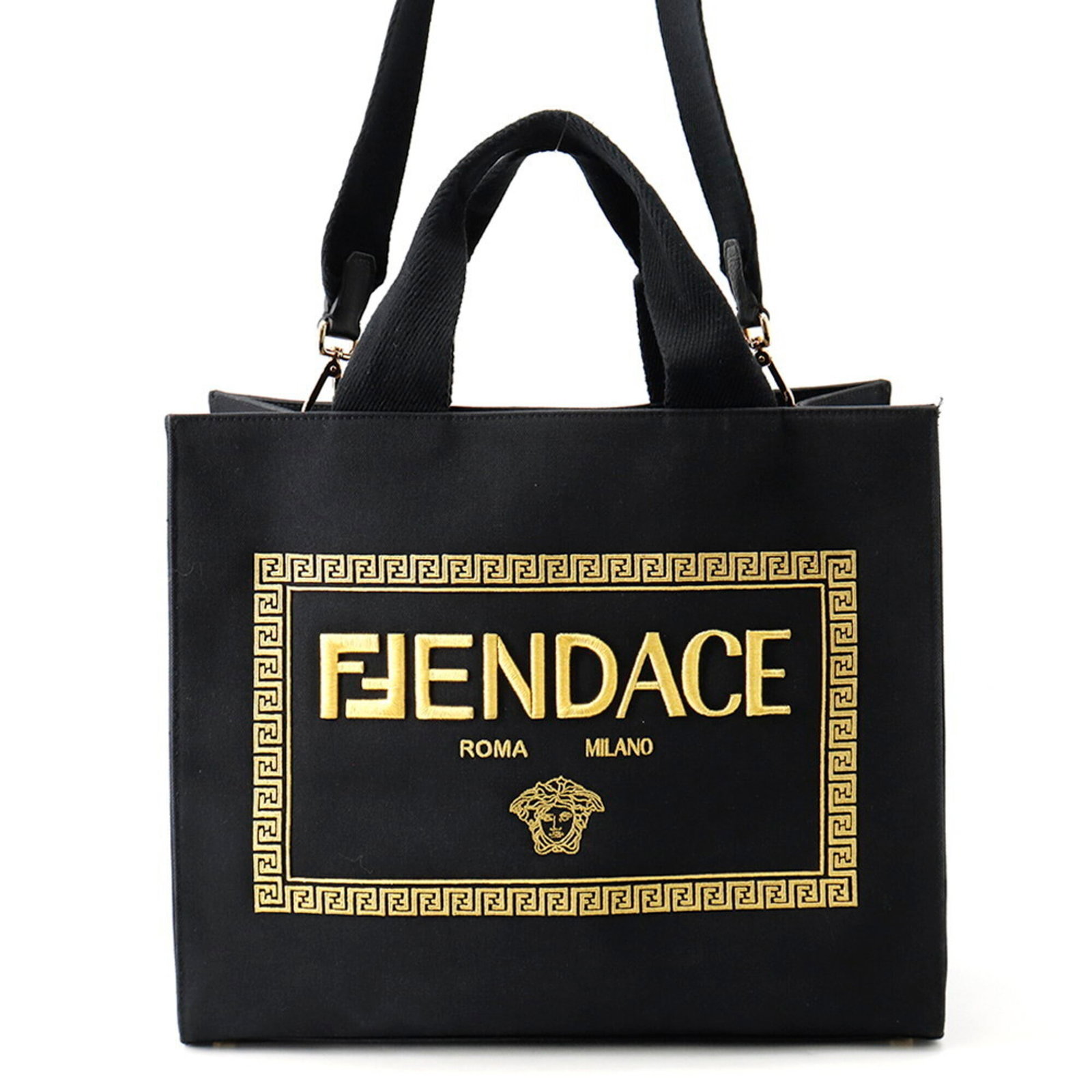 Canvas Handbag Fendi Tote: Canvas Handbag Fendi Tote Canvas Fendi Tote in Black and Gold. This iconic tote bag features a canvas material, black and gold hardware, and a striking gold-tone strap. Measuring 33.5cm x 40cm x