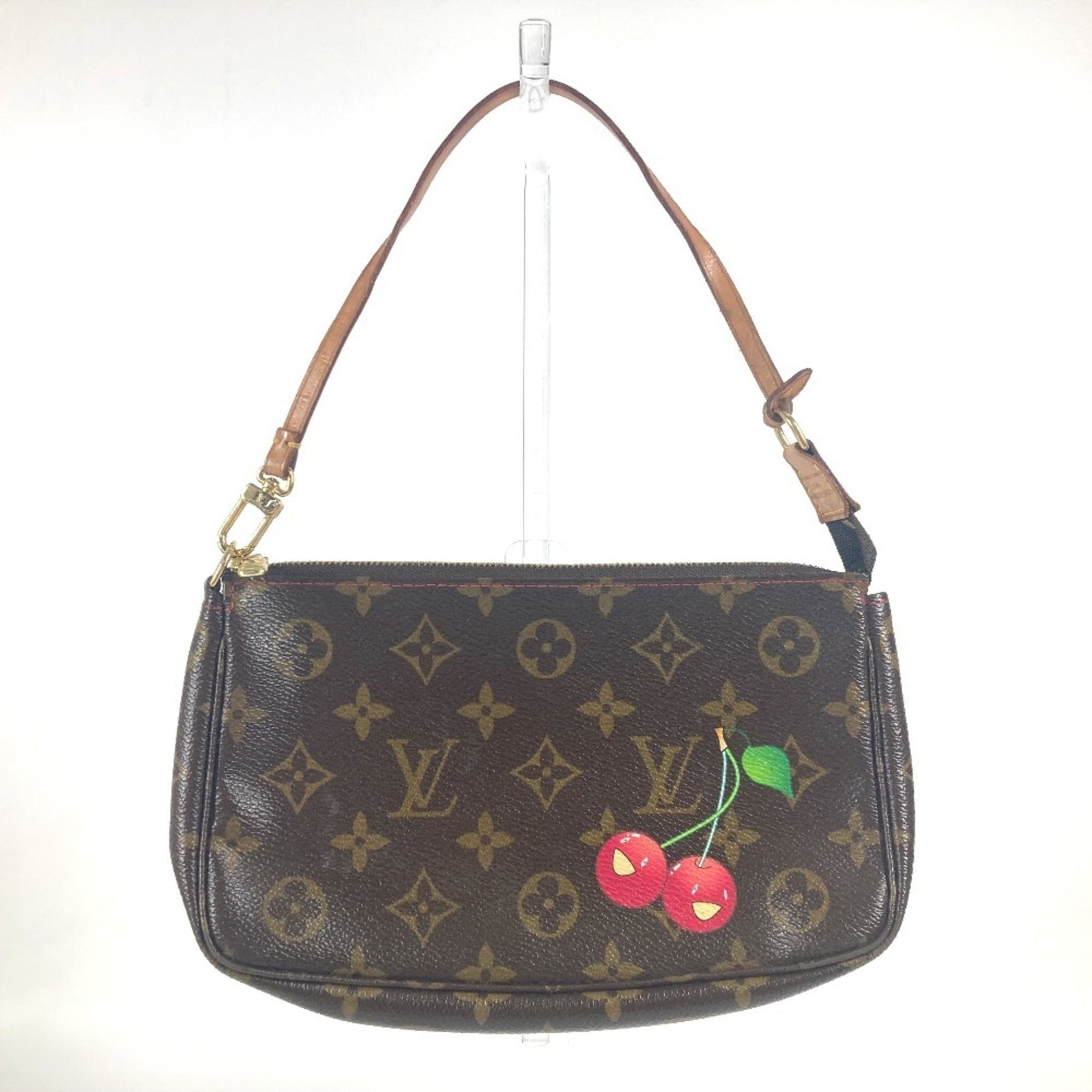 Vuitton Pochette Pouch: Vuitton Pochette Pouch Brown, Monogram Cherry, Red color Vuitton Pochette Pouch measures 12.5cm x 21cm x 2.5cm, featuring the iconic Monogram pattern. This stylish pouch is made of a classic design, w