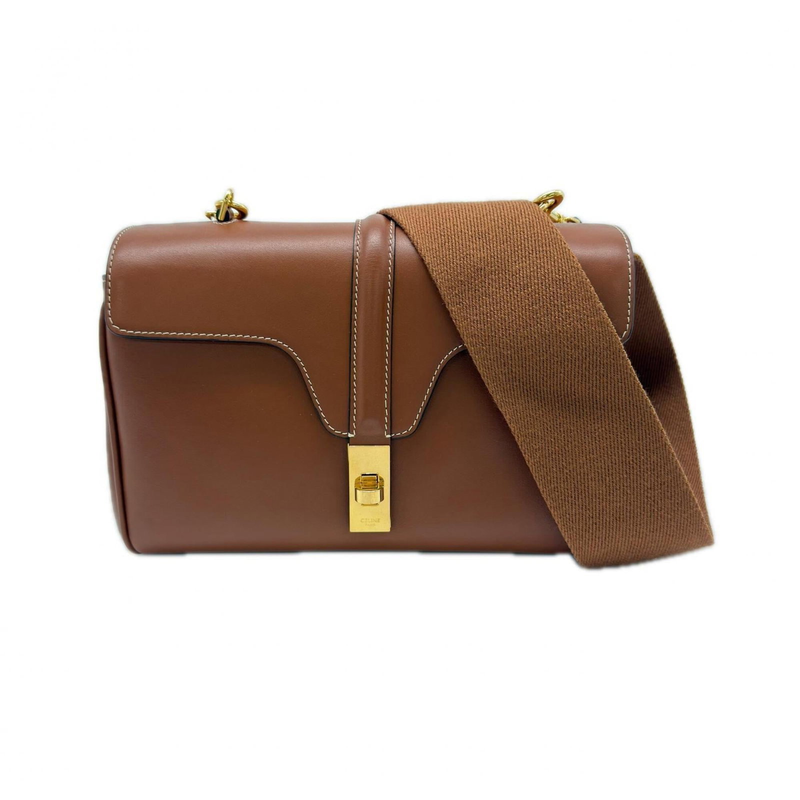 Shoulder Bag Leather Celine: Shoulder Bag Leather Celine The Celine shoulder bag is crafted from high-quality leather, featuring a rich brown calfskin material. Measuring 16cm x 24cm x 8cm, it boasts a sleek design with a