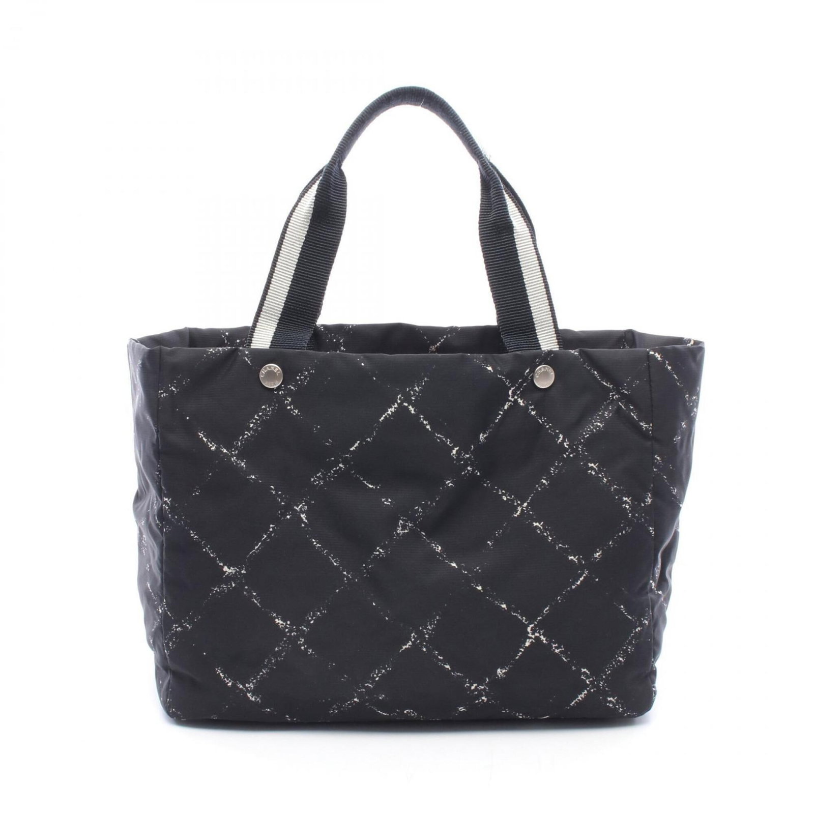 Nylon Chanel Tote Bag: Nylon Chanel Tote Bag This sleek Chanel tote bag is crafted from durable nylon, featuring a timeless black and white color scheme and silver hardware for a chic, sophisticated look. Measuring 26cm x